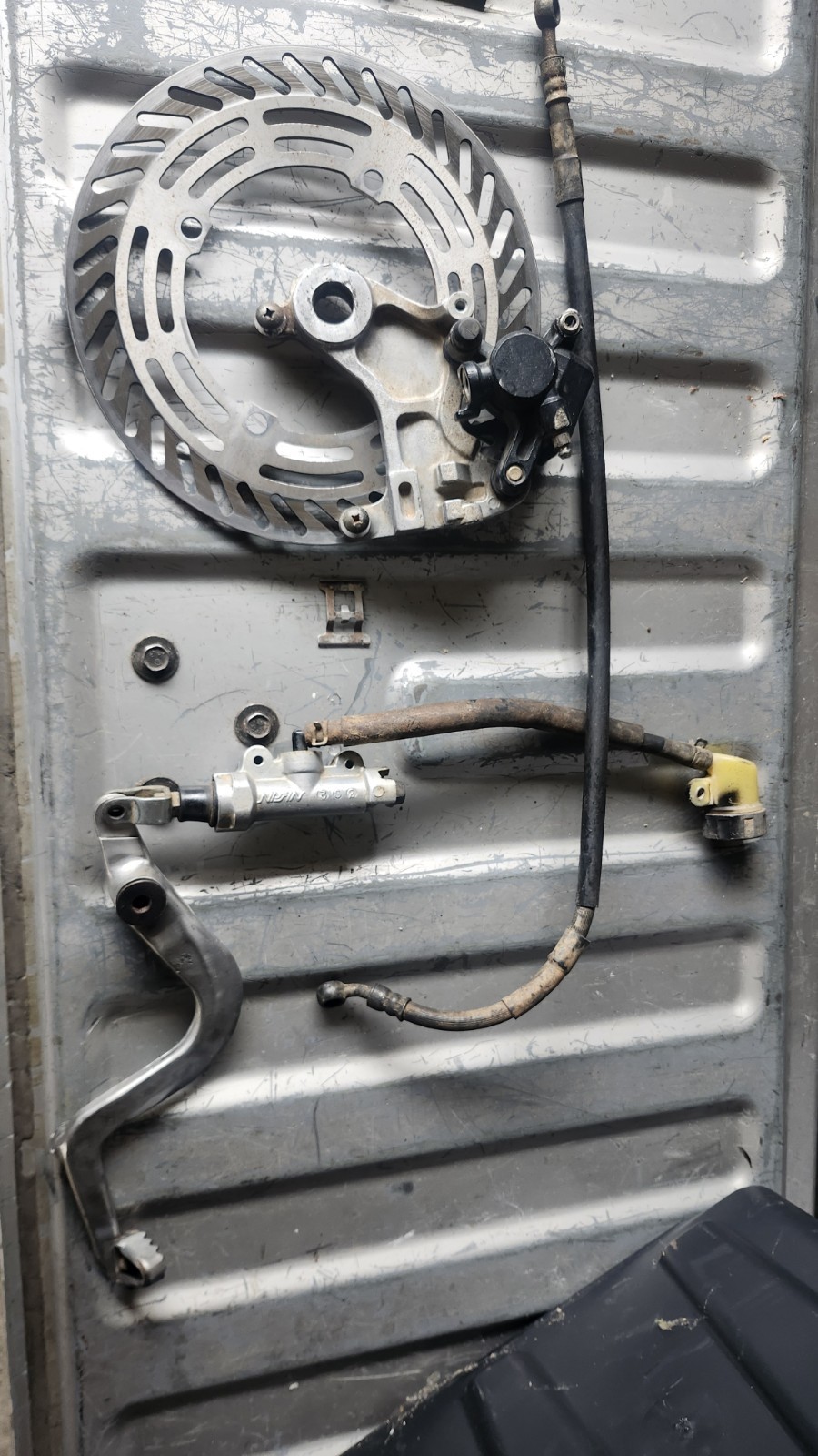 1987 87-89 Honda CR500R Cr 125R 250R 500 OEM REAR BRAKE CALIPER BRACKET ASSY