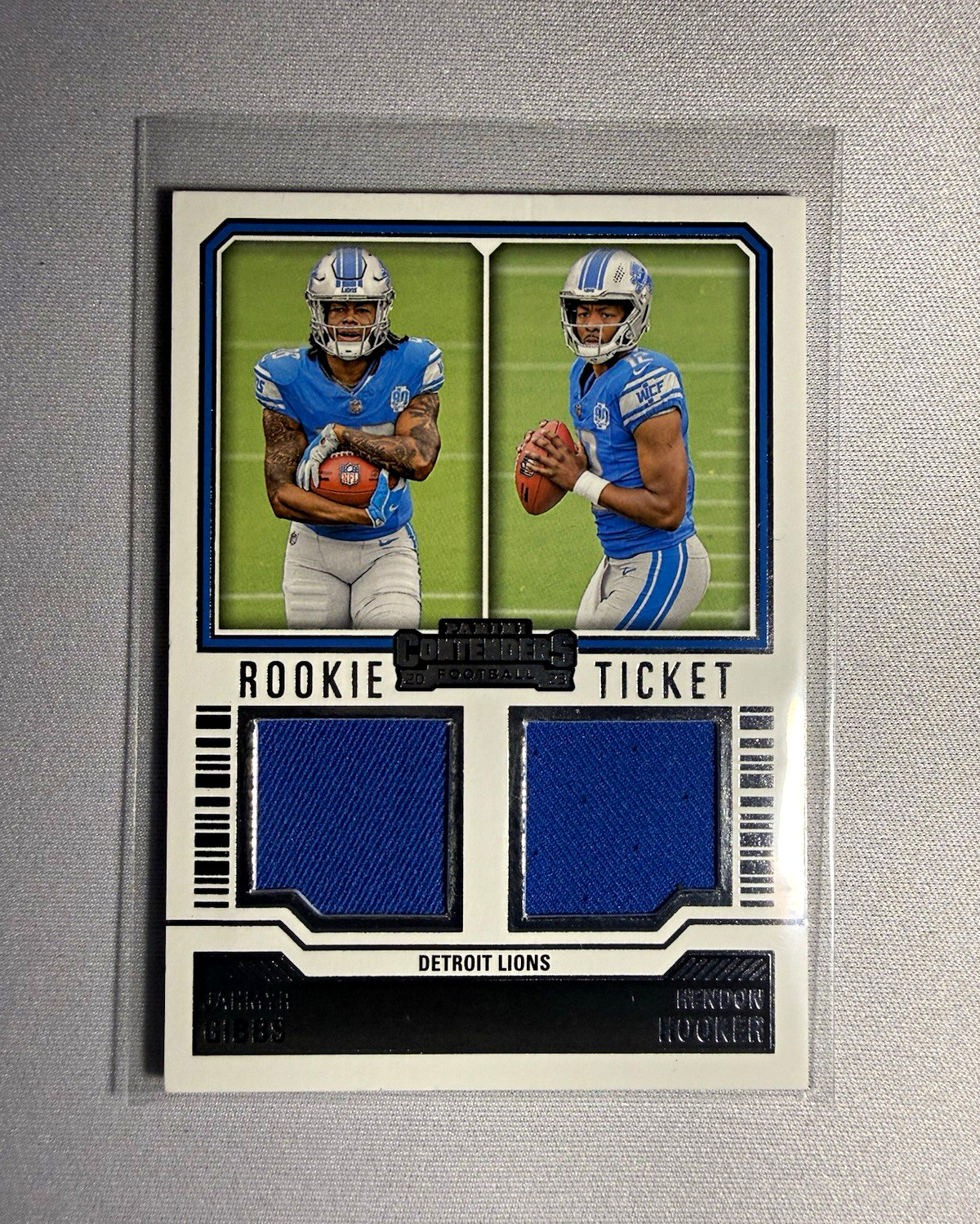 2023 Panini Contenders Dual Swatches Jahmyr Gibbs, Hendon Hooker DS-9 RC MEM