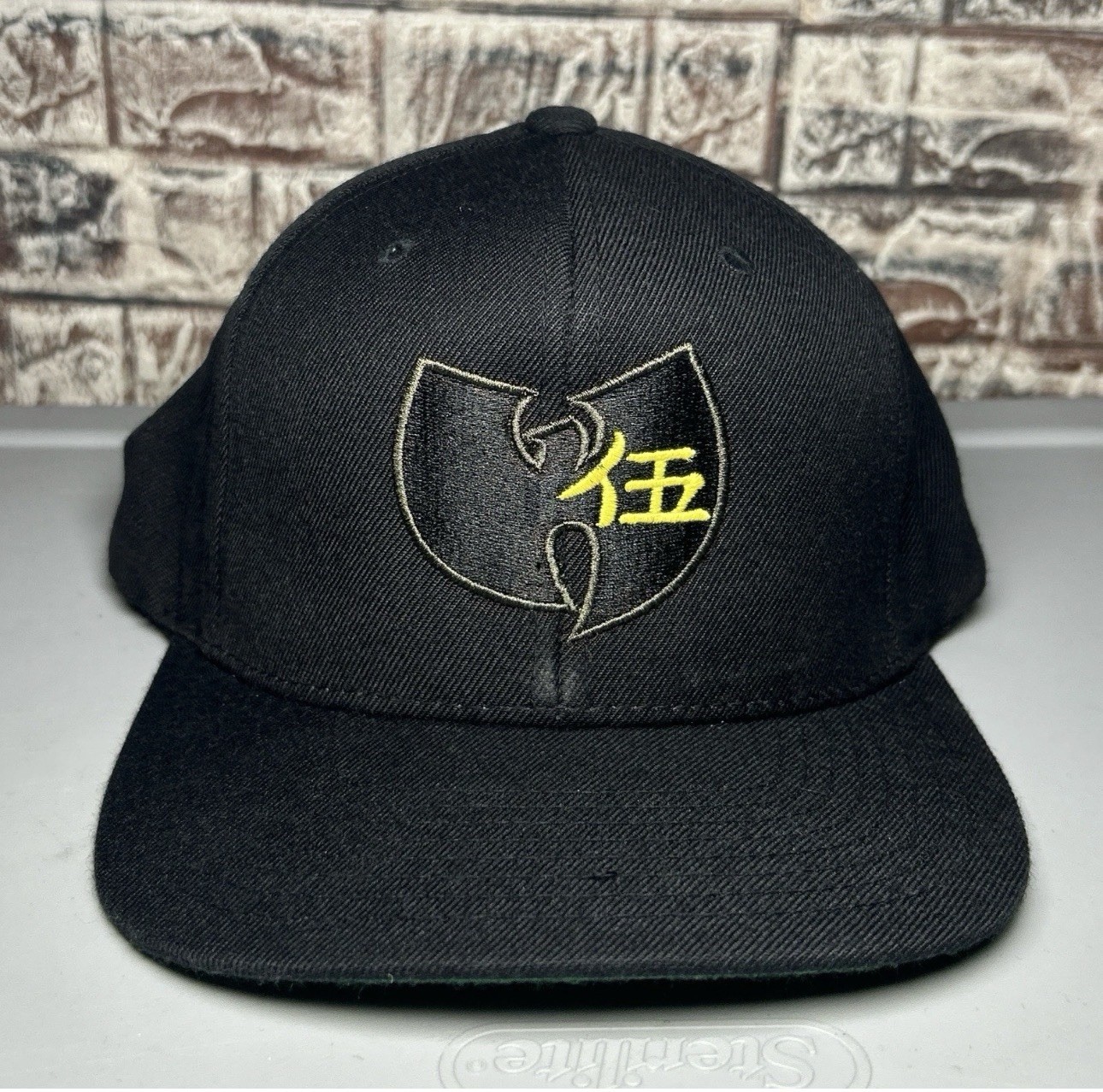 Wu-Tang Clan Black Snapback Hat Featuring An Embroidered Yellow Logo Wu-Tang Clan Black Snapback Hat Featuring An Embroidered Yellow Logo