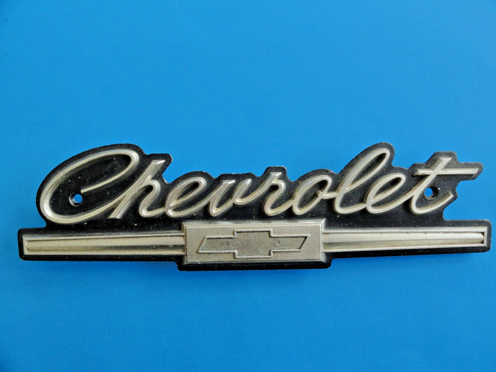 1960\'S CHEVY LOGO GRILL FENDER SCRIPT EMBLEM ALUMINUM - FACTORY ORIGINAL