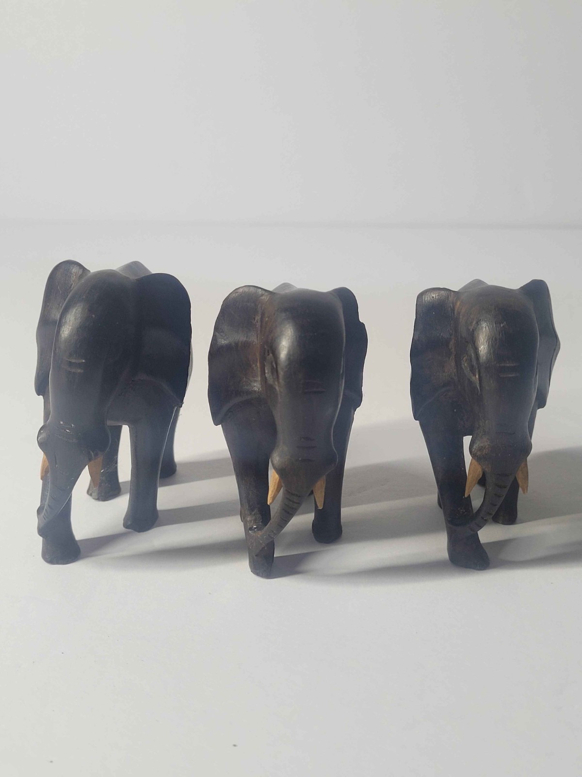 Vintage Hand Carved Wooden Elephant Statues Trio Dark Brown Faux Tusks Decor Set Vintage Hand Carved Wooden Elephant Statues Trio Dark Brown Faux Tusks Decor Set