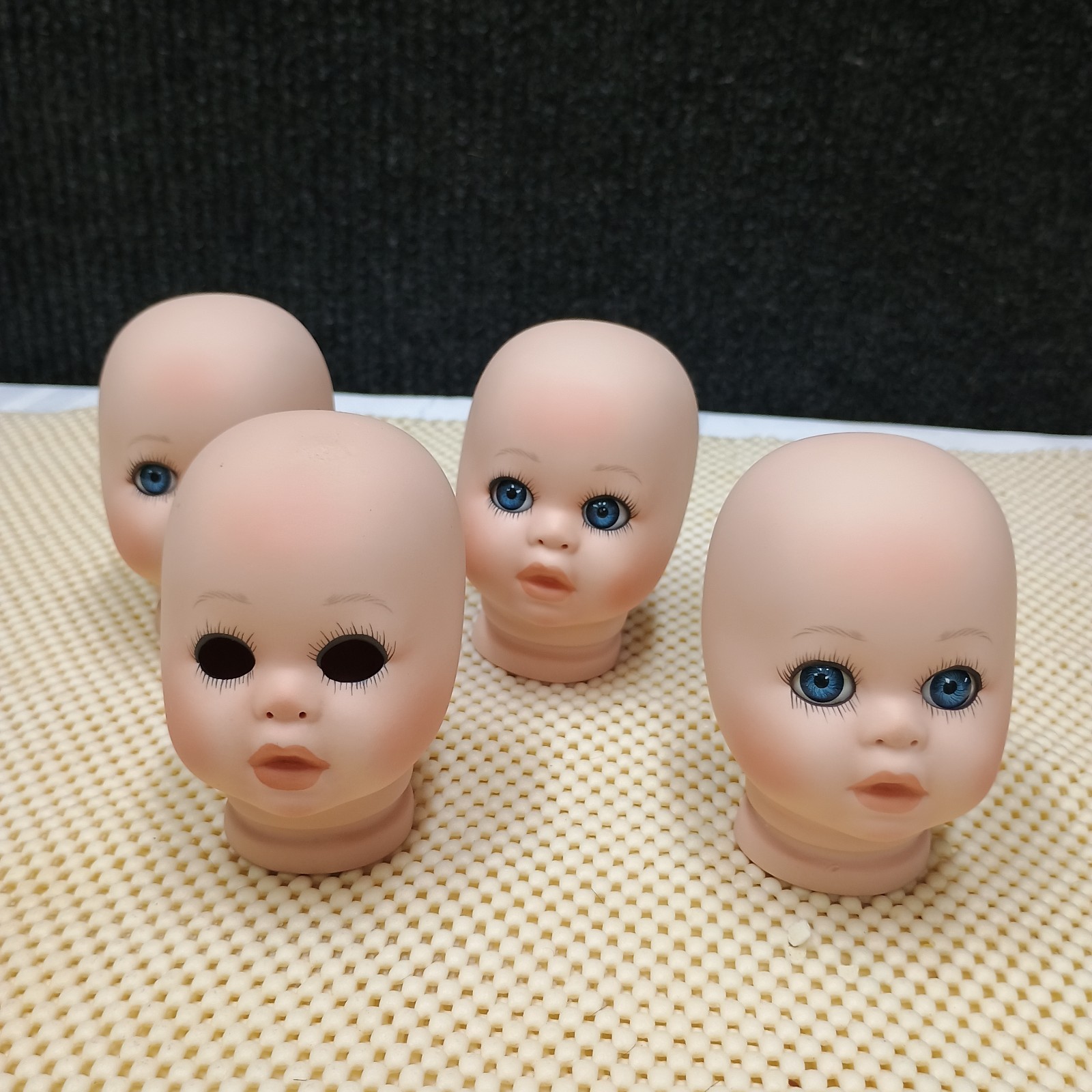 4 pack Vintage 3.4 in Bisque doll heads. no hair & may or may not have eyes