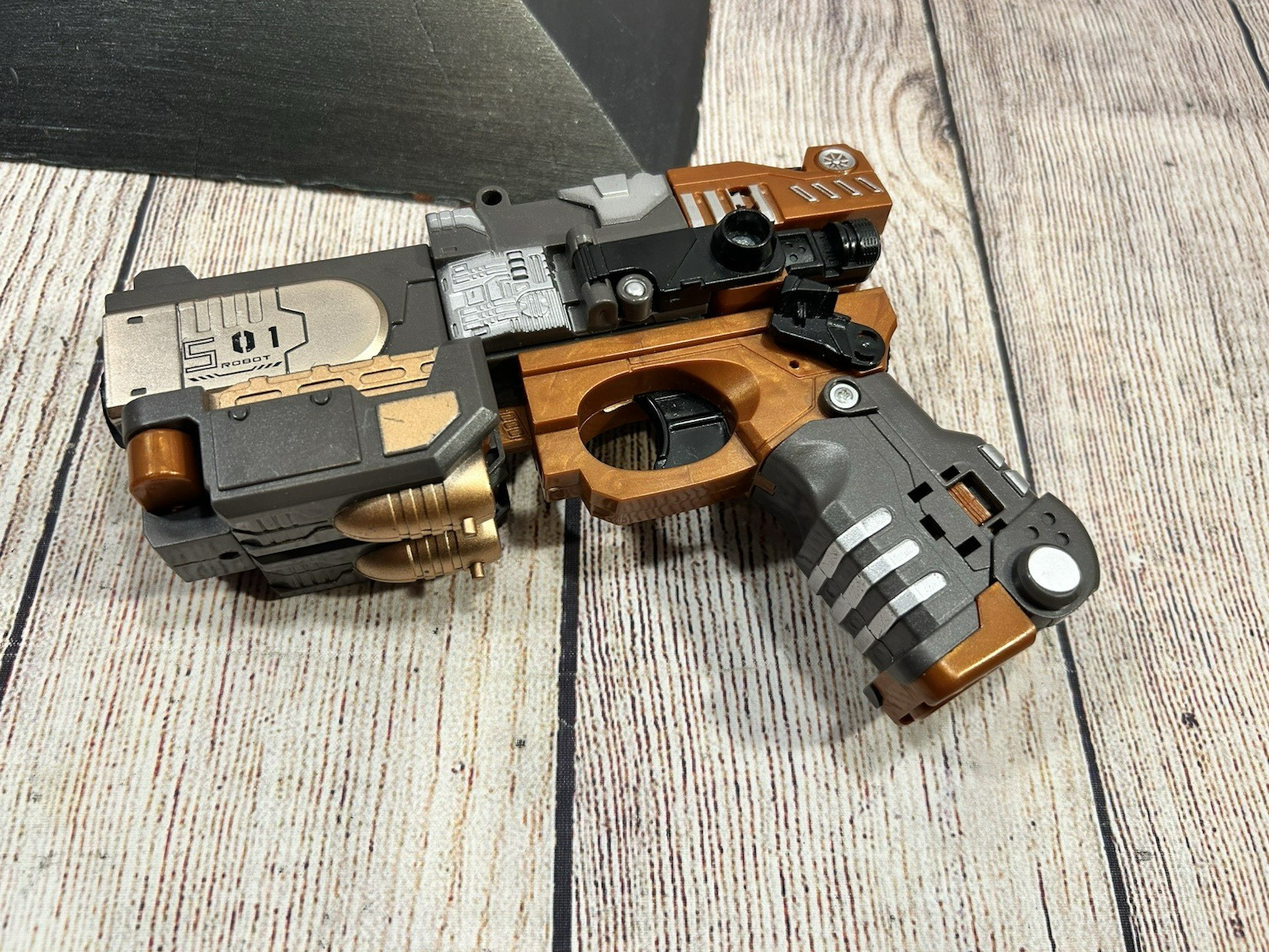 Transforming Toy Blaster Pistol Robot Action Figure Orange Tip Dart Style