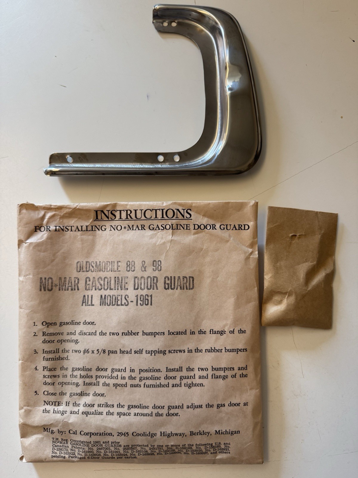 NOS 1961 Oldsmobile Starfire 88 & 98 Gas Door Guard