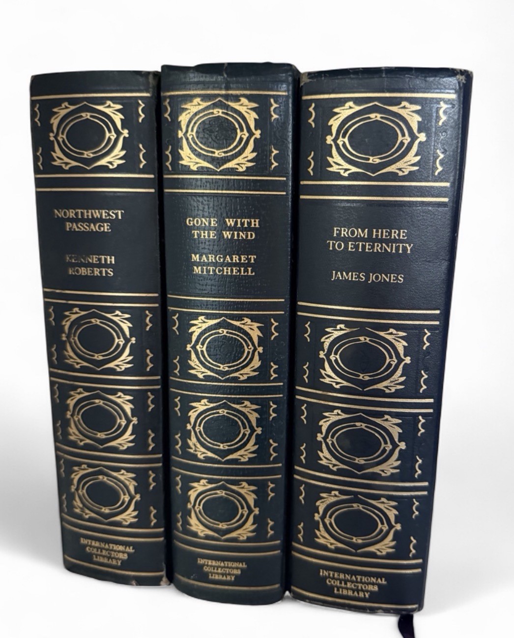 three vintage hardcover books are from the International Collectors Library