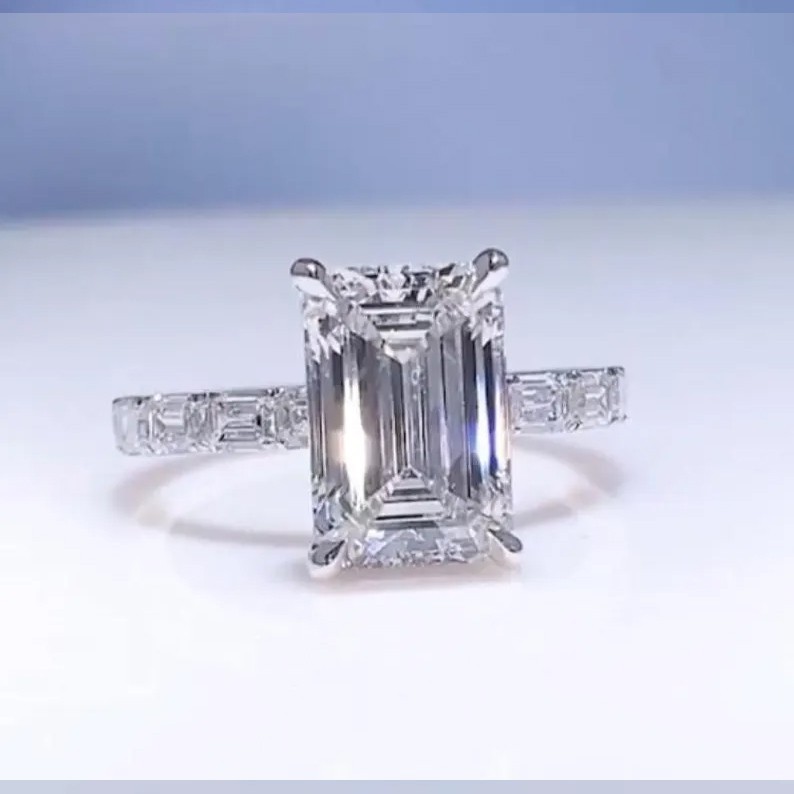 Certified 6.00 Ct White Emerald Cut Treated Diamond Solitaire Ring in 925 Silver