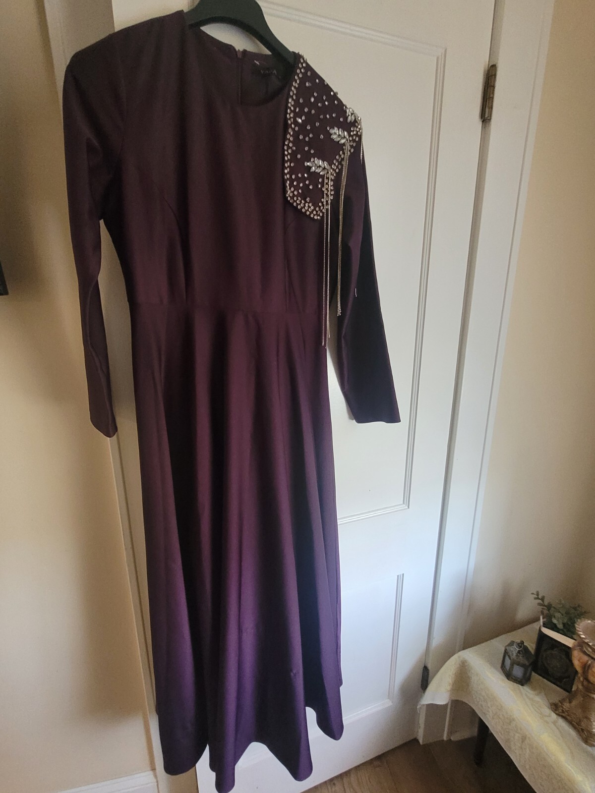 Yaffa long sleeve dress nicely beaded . Purple in color. Yaffa long sleeve dress nicely beaded . Purple in color.