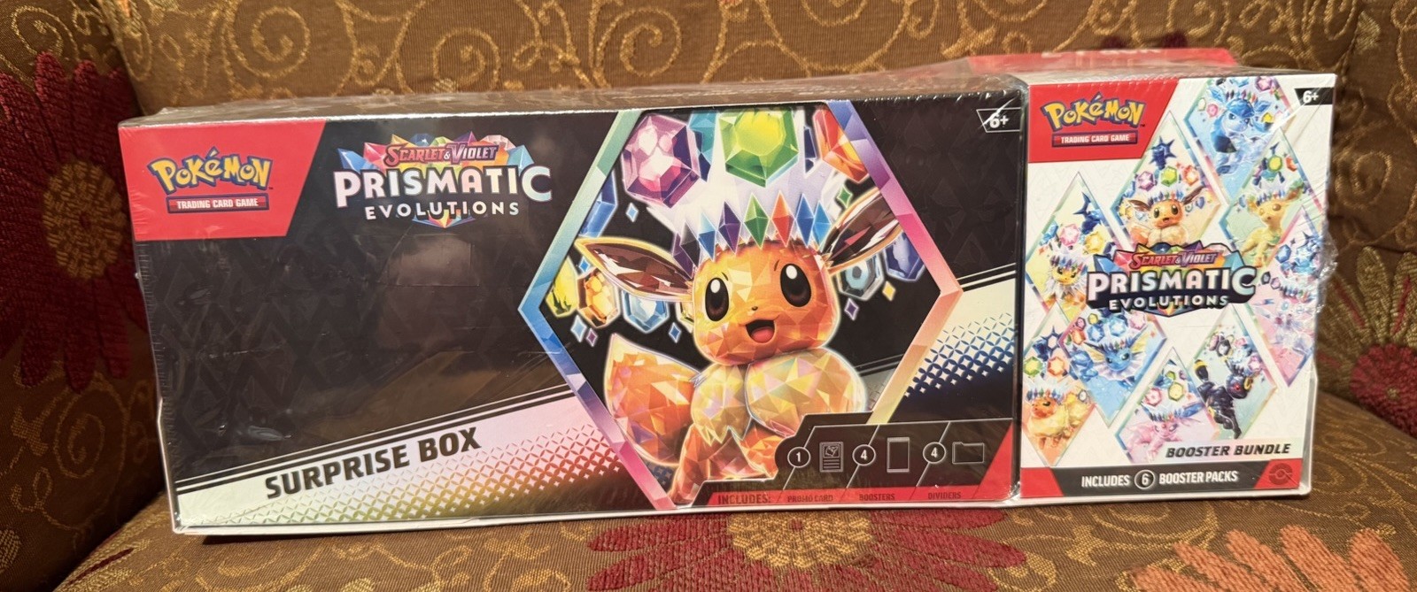 Pokémon TCG Prismatic Evolutions Surprise Box + Booster Bundle Eevee Sam’s Club