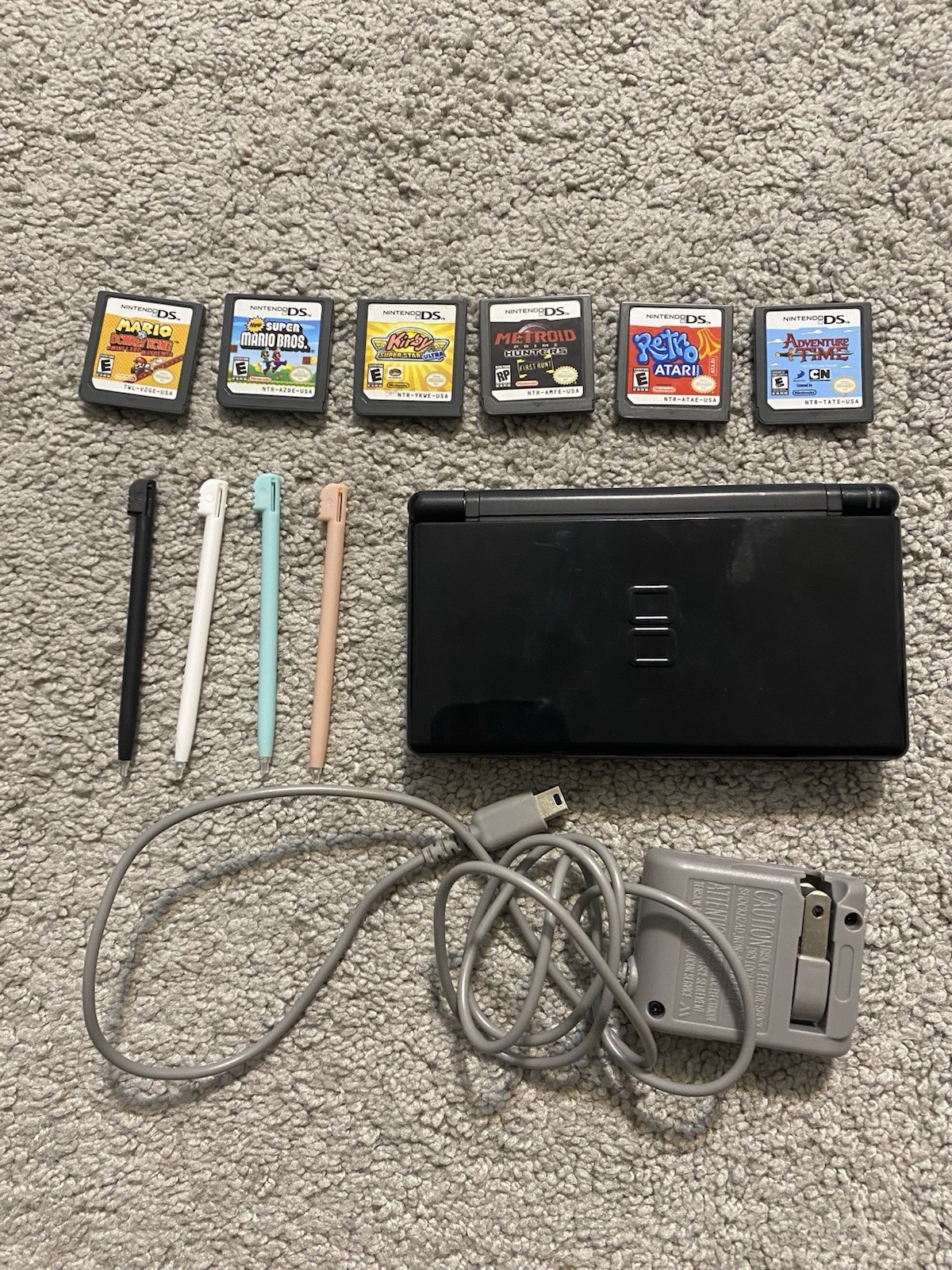 Black Nintendo DS Lite With Six Games, Charger And Styluses Tested Works Great Black Nintendo DS Lite With Six Games, Charger And Styluses Tested Works Great