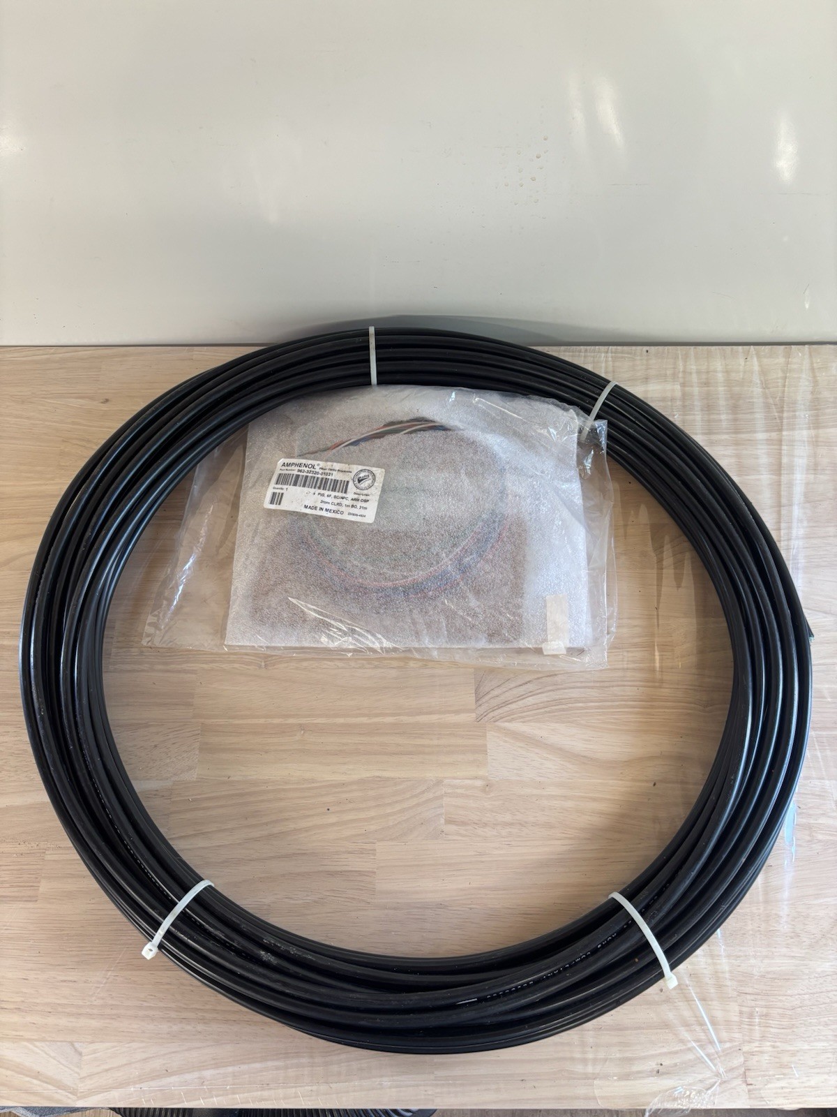 Amphenol Part number 962-32320-01031  PIG, 6F, SC/APC, ARM, OSP. 2mm CLRD, 1mBO,