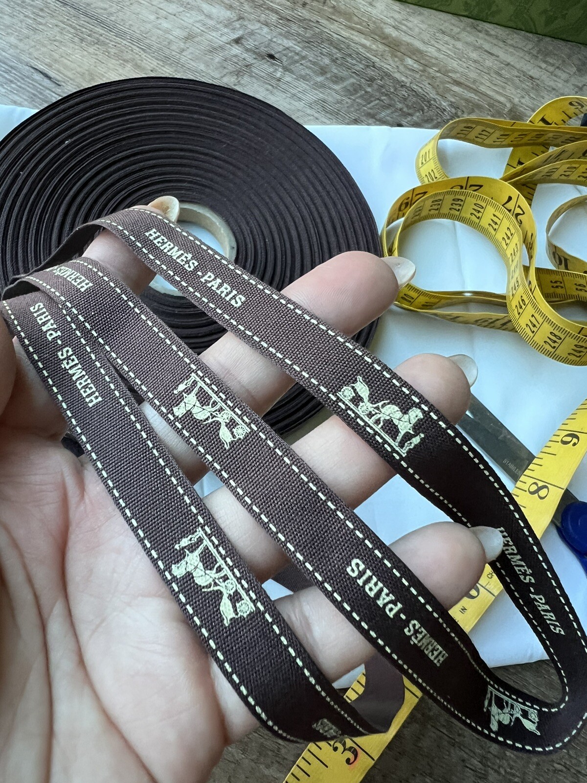 💯% Authentic ❤️Hermes , Brown w/white logo horse ribbon~sold by the yard