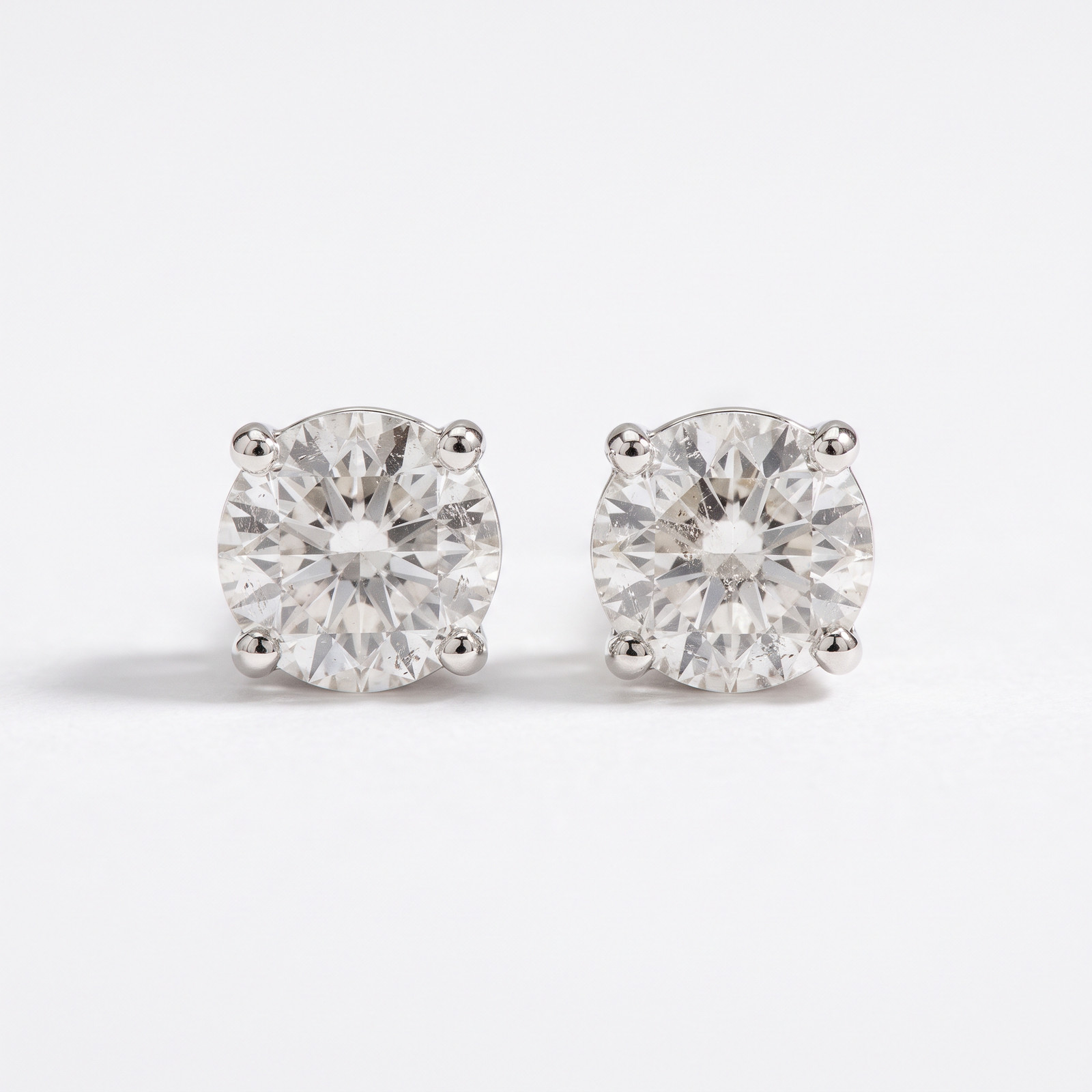 1/4 - 2 Ct T.W. Natural Diamond Studs in 14k White or Yellow Gold