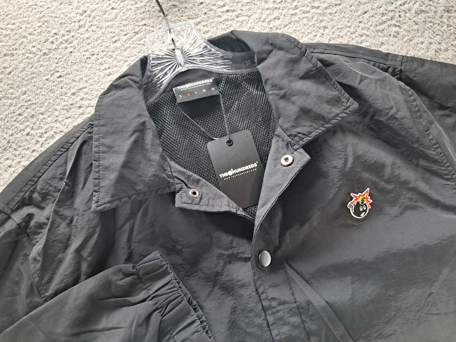 The Hundreds Jacket Mens Medium Black Coach Windbreaker Adam Bomb Patch Logo NWT