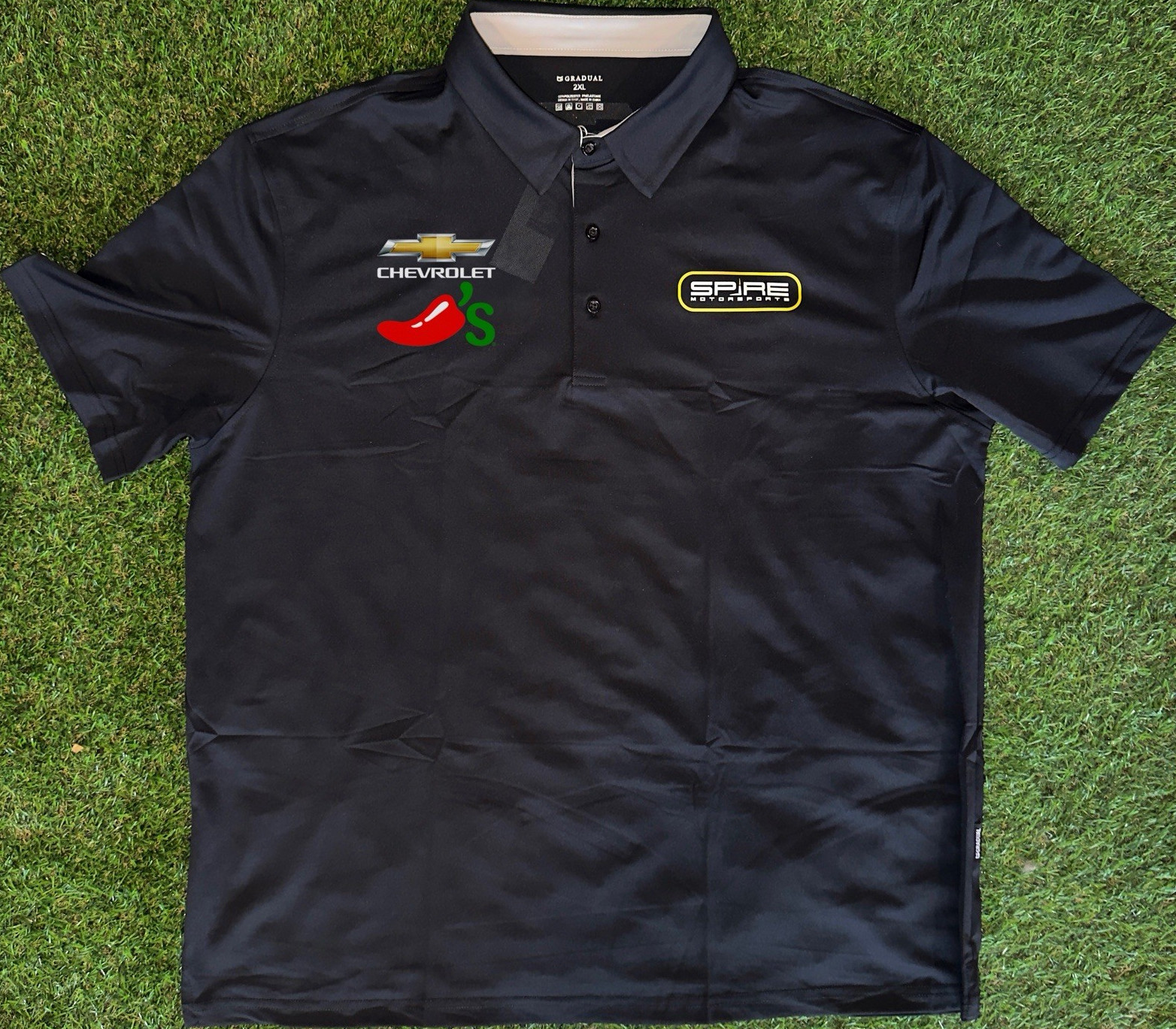 2026 Carson Hocevar Spire Motorsports Chevrolet / Chili’s Fan Day Polo (XL) 2026 Carson Hocevar Spire Motorsports Chevrolet / Chili’s Fan Day Polo (XL)