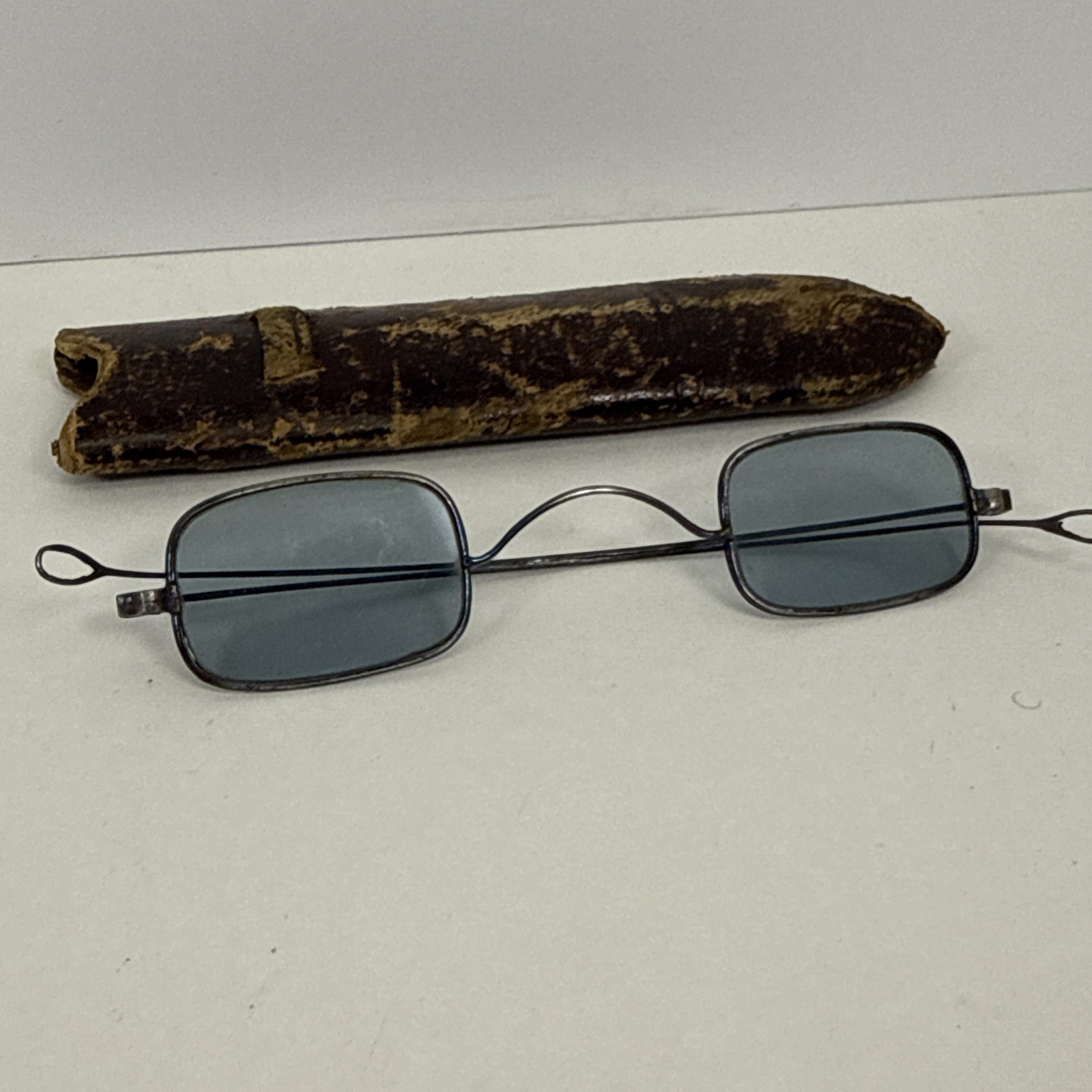 Antique sunglasses Civil War era with blue lenses and double hinged earpieces Antique sunglasses Civil War era with blue lenses and double hinged earpieces
