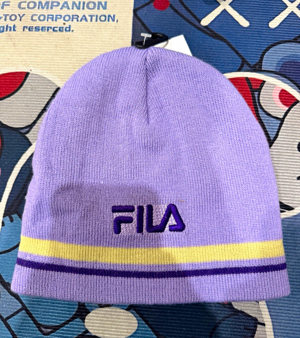 FILA Men\'s Purple & Yellow Striped Knit Beanie Hat, One Size FILA Men\'s Purple & Yellow Striped Knit Beanie Hat, One Size