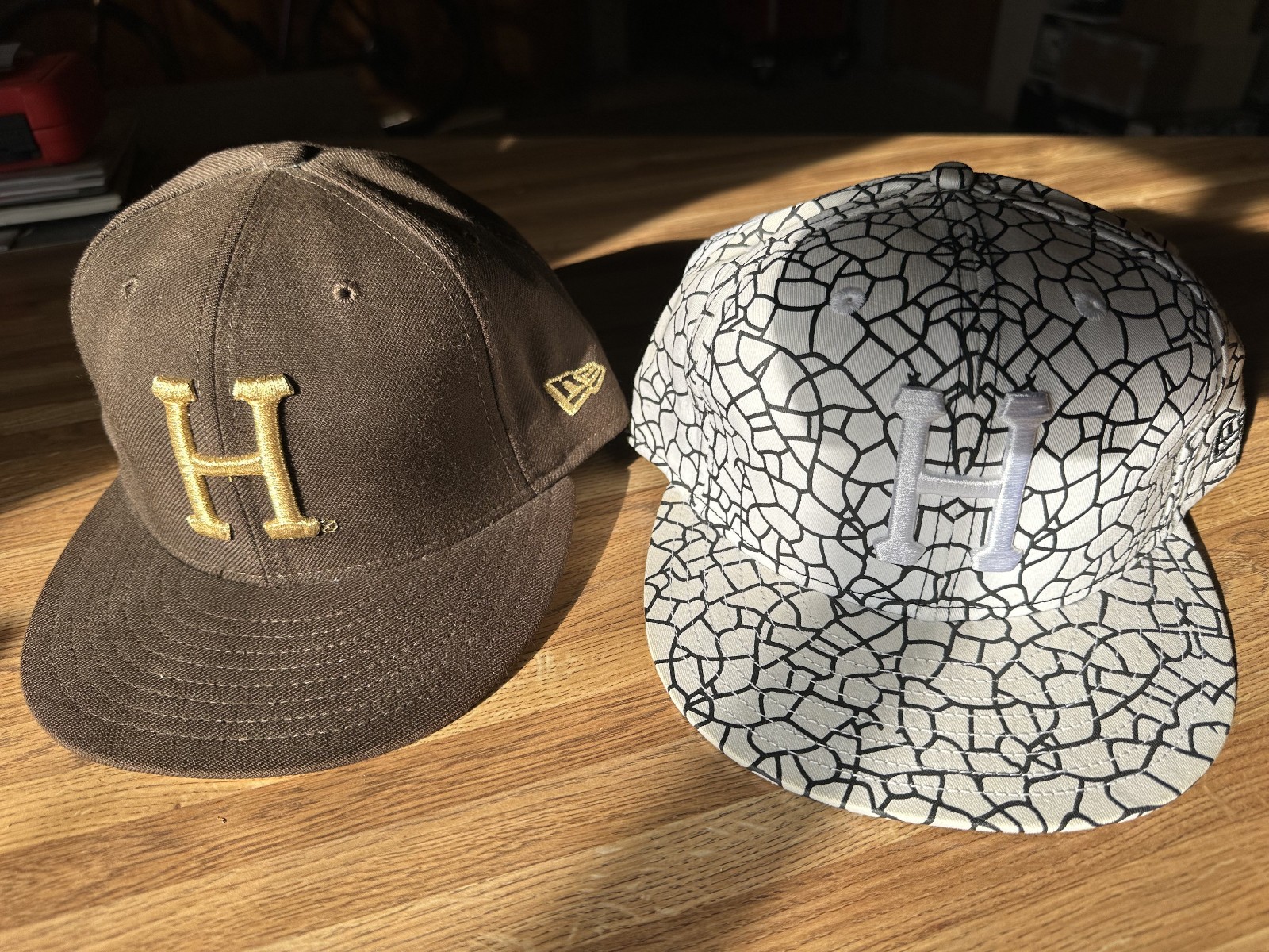 A couple of HUF New Era caps from the early 2000\'s - worn but good condition