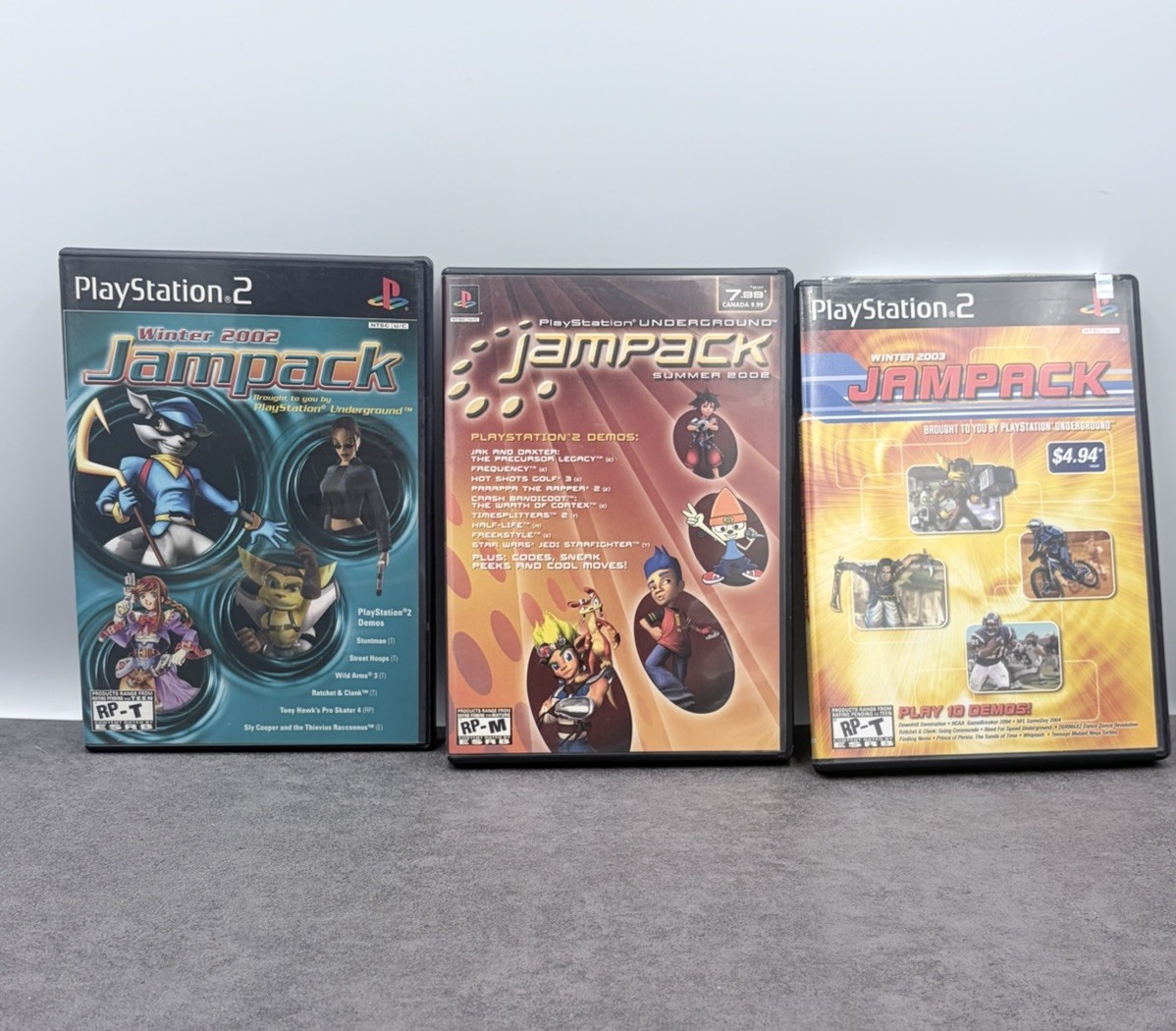 Jampack Lot x3 Sony PS2 (2002 & 2003) Half-Life, Sly Cooper, Jak, Ratchet CIB