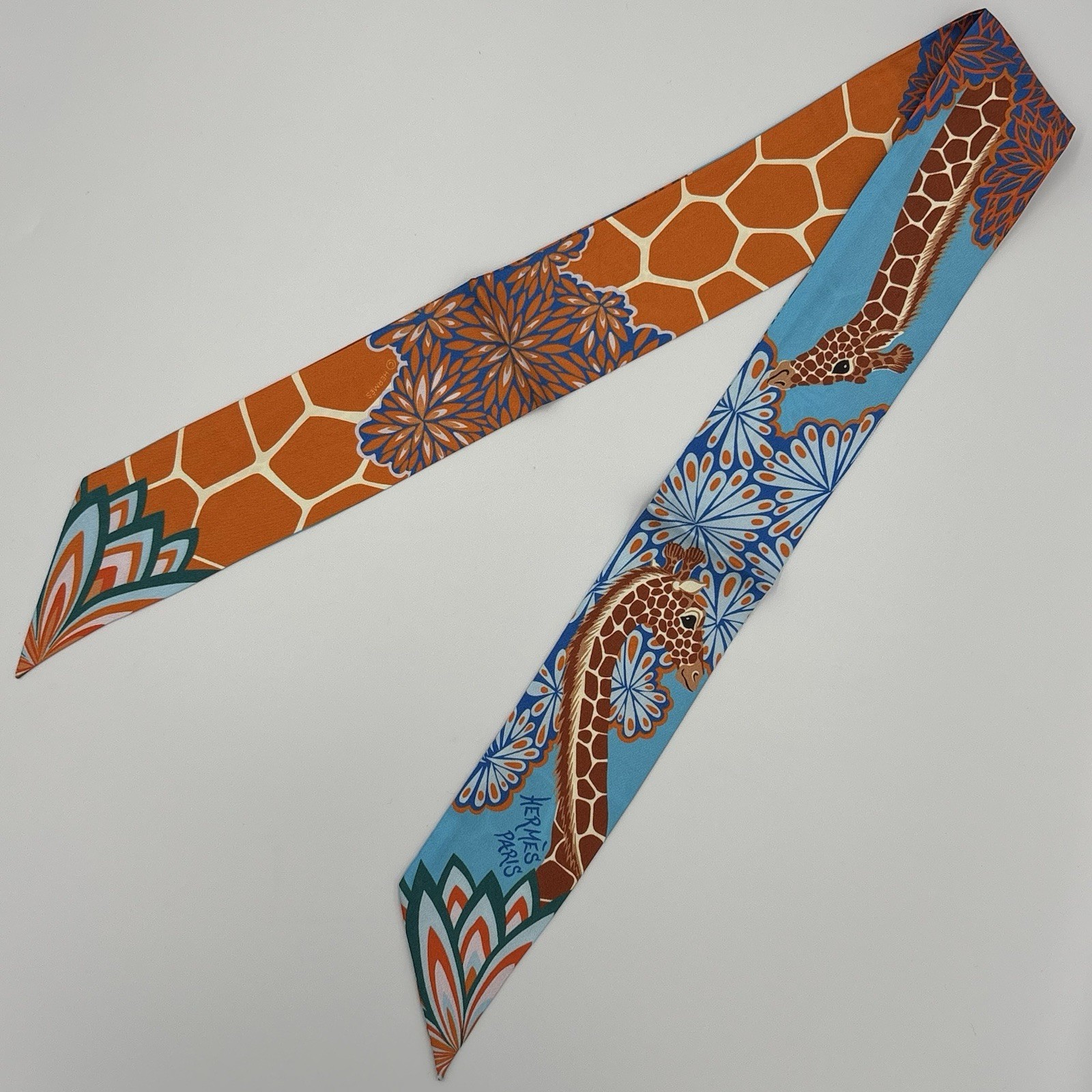 Hermes The Three Graces Twilly Scarf Bleu Jean Orange Rouille Silk Hermes The Three Graces Twilly Scarf Bleu Jean Orange Rouille Silk