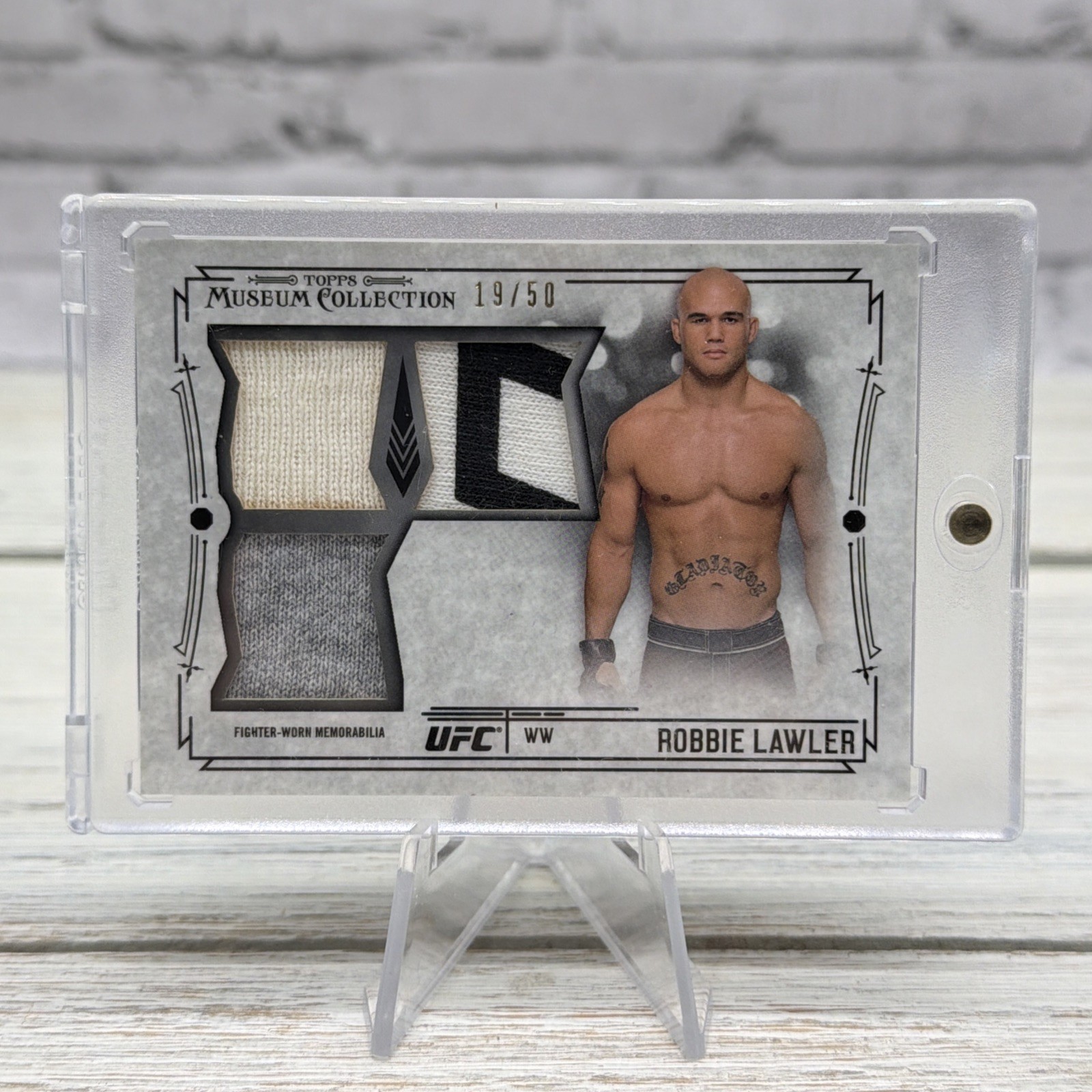 2015 Topps UFC Knockout Museum Gold Triple Relic Card # /50 ROBBIE LAWLER 2015 Topps UFC Knockout Museum Gold Triple Relic Card # /50 ROBBIE LAWLER