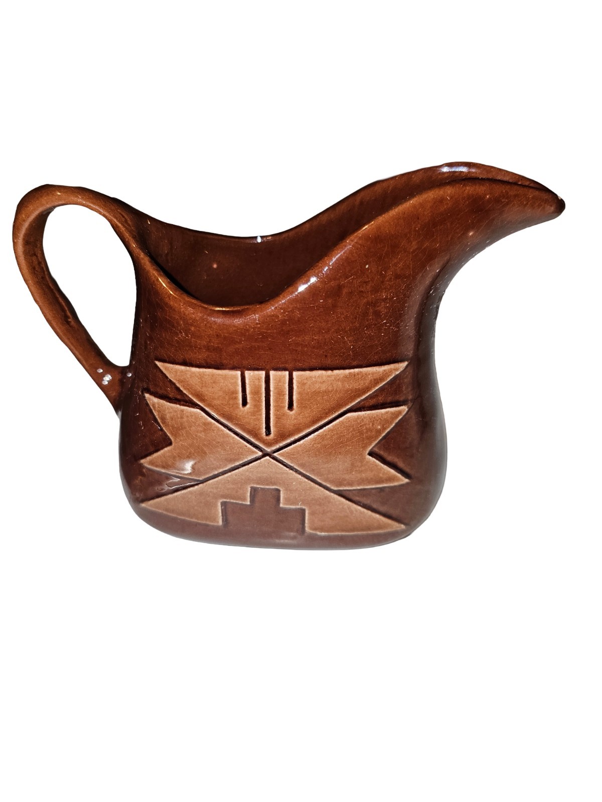Brown Sioux or Lakota pottery small pitcher with geometric inlay of phoenix