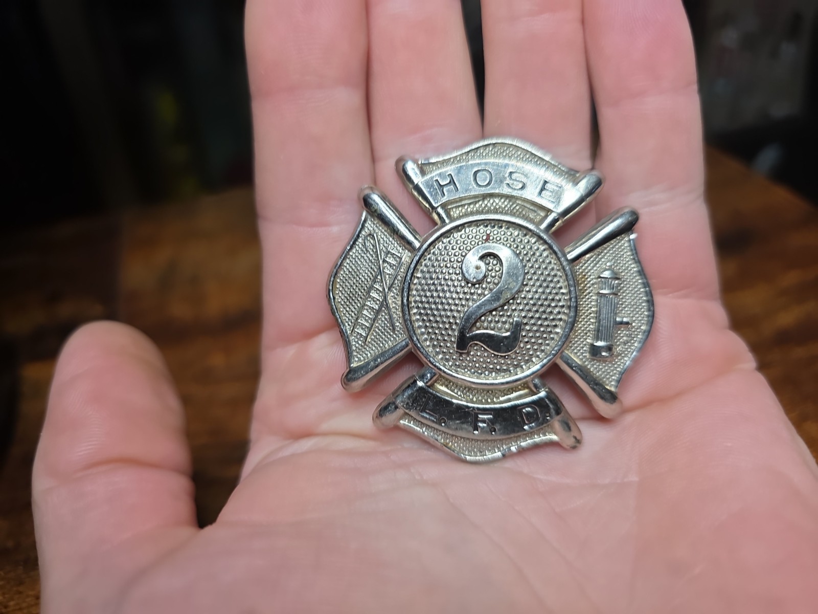 Vintage L. F. D. Fire Department Metal Hat Badge. Vintage L. F. D. Fire Department Metal Hat Badge.