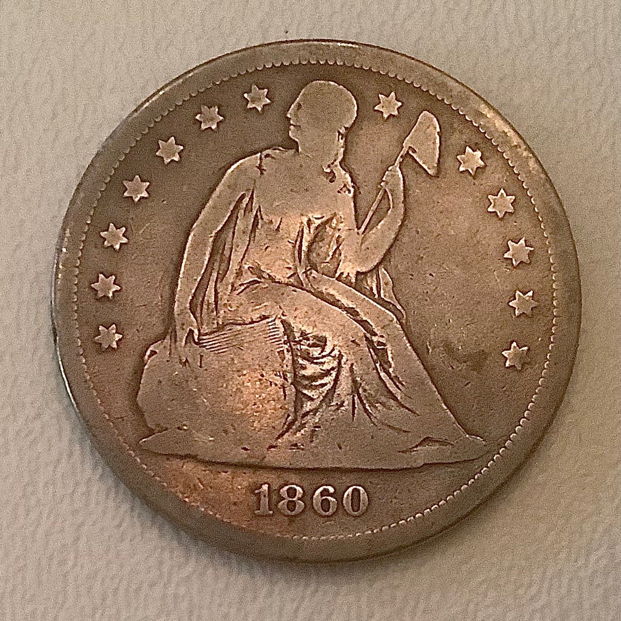 1860 O Seated  Liberty SILVER DOLLAR