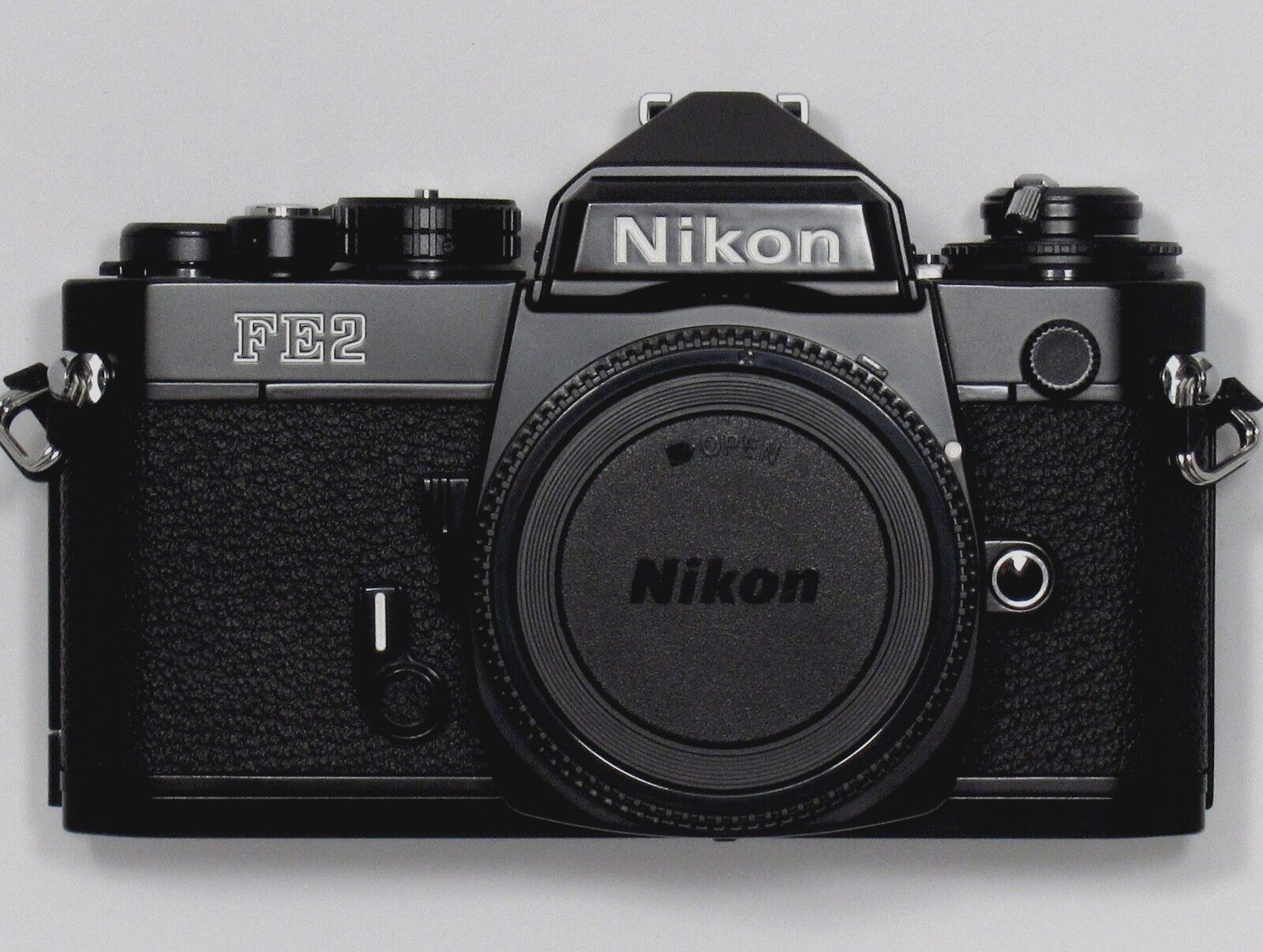 NEW in BOX UNUSED Nikon FE2 35mm Black Camera W/ Titan Shutter We are US seller.