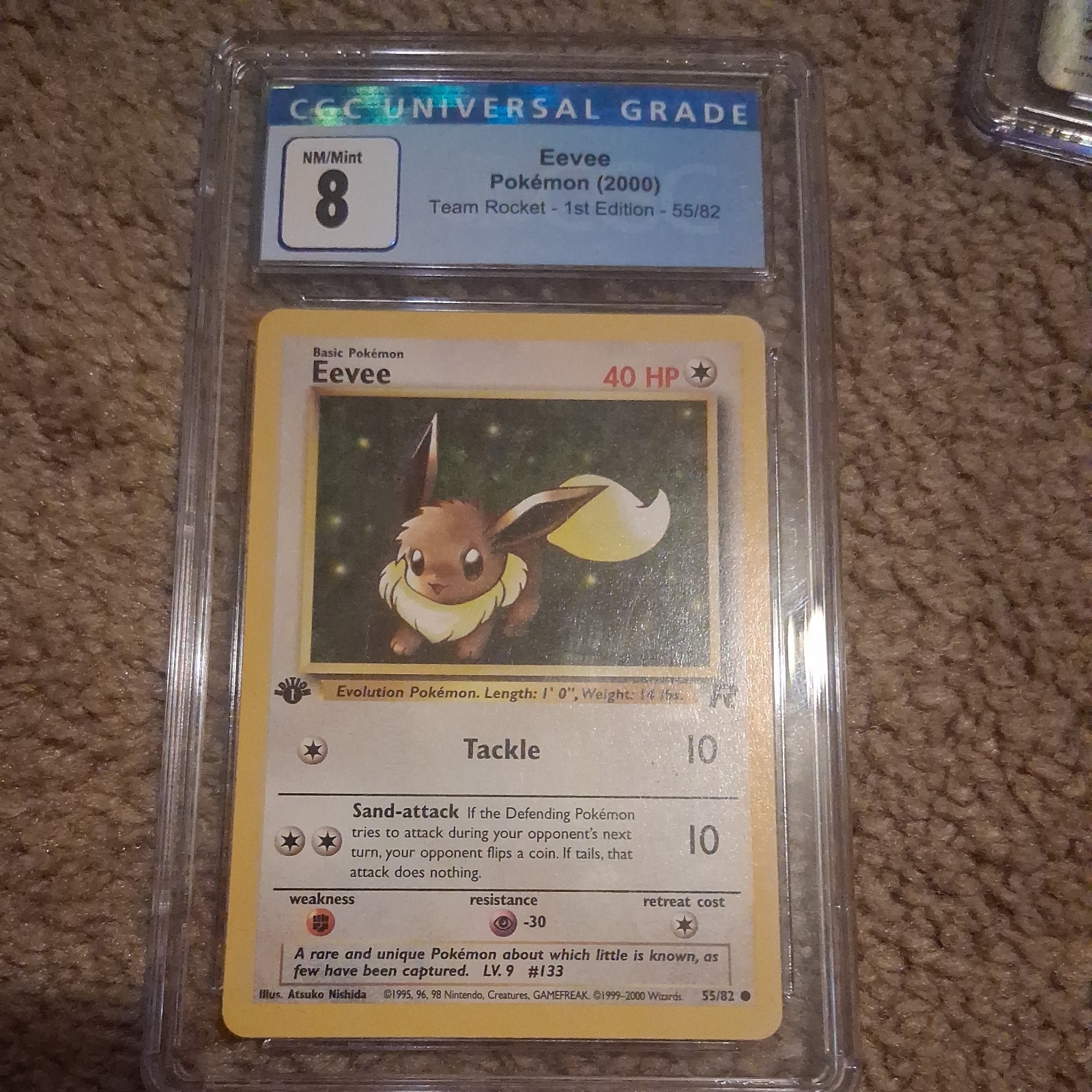 Eevee 55/82 Team Rocket - 1st Ed. Pokemon CGC 8 Eevee 55/82 Team Rocket - 1st Ed. Pokemon CGC 8