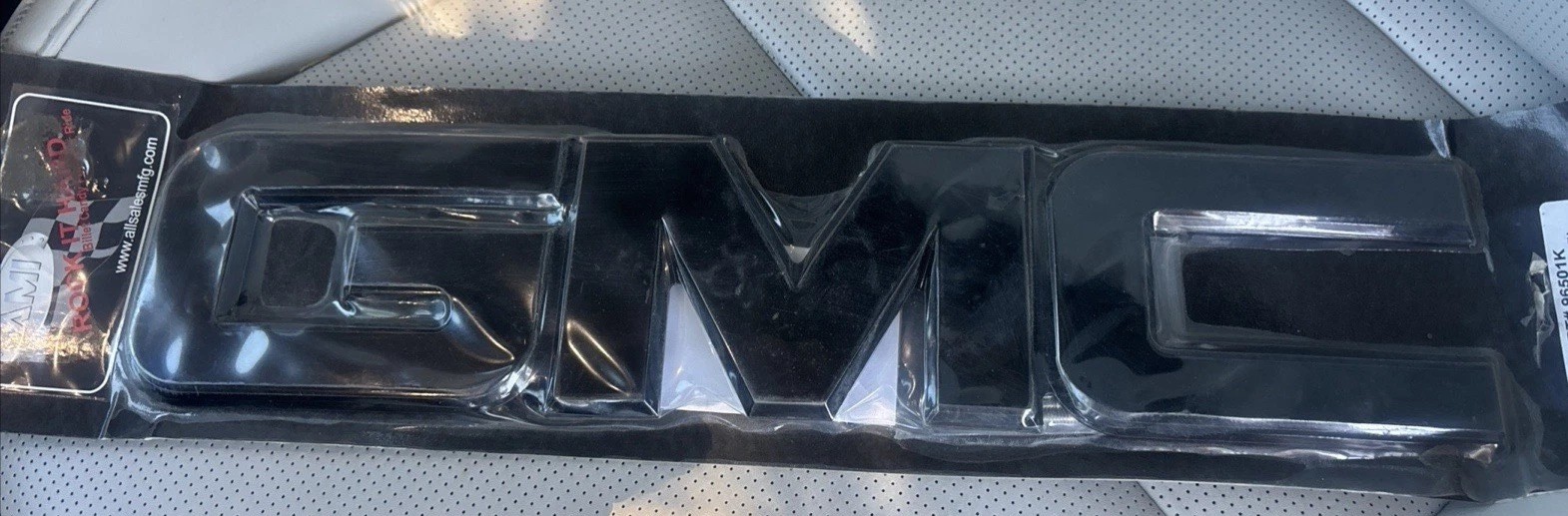 Fits: 2008--2010 GMC Serra  Front Billet Grille Emblem BLACK 96501K AMI USA