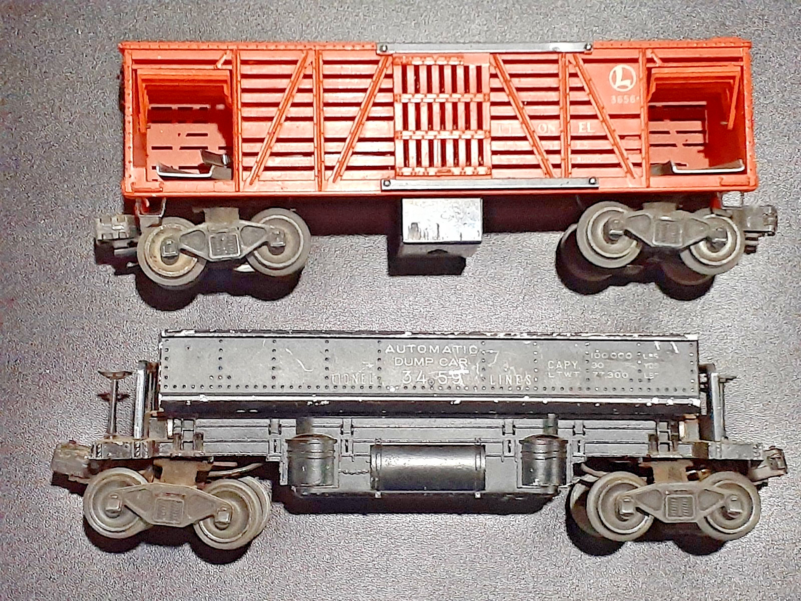 Lionel Post War Train Cars A Side Dump Car and An Operating Cattle Car.