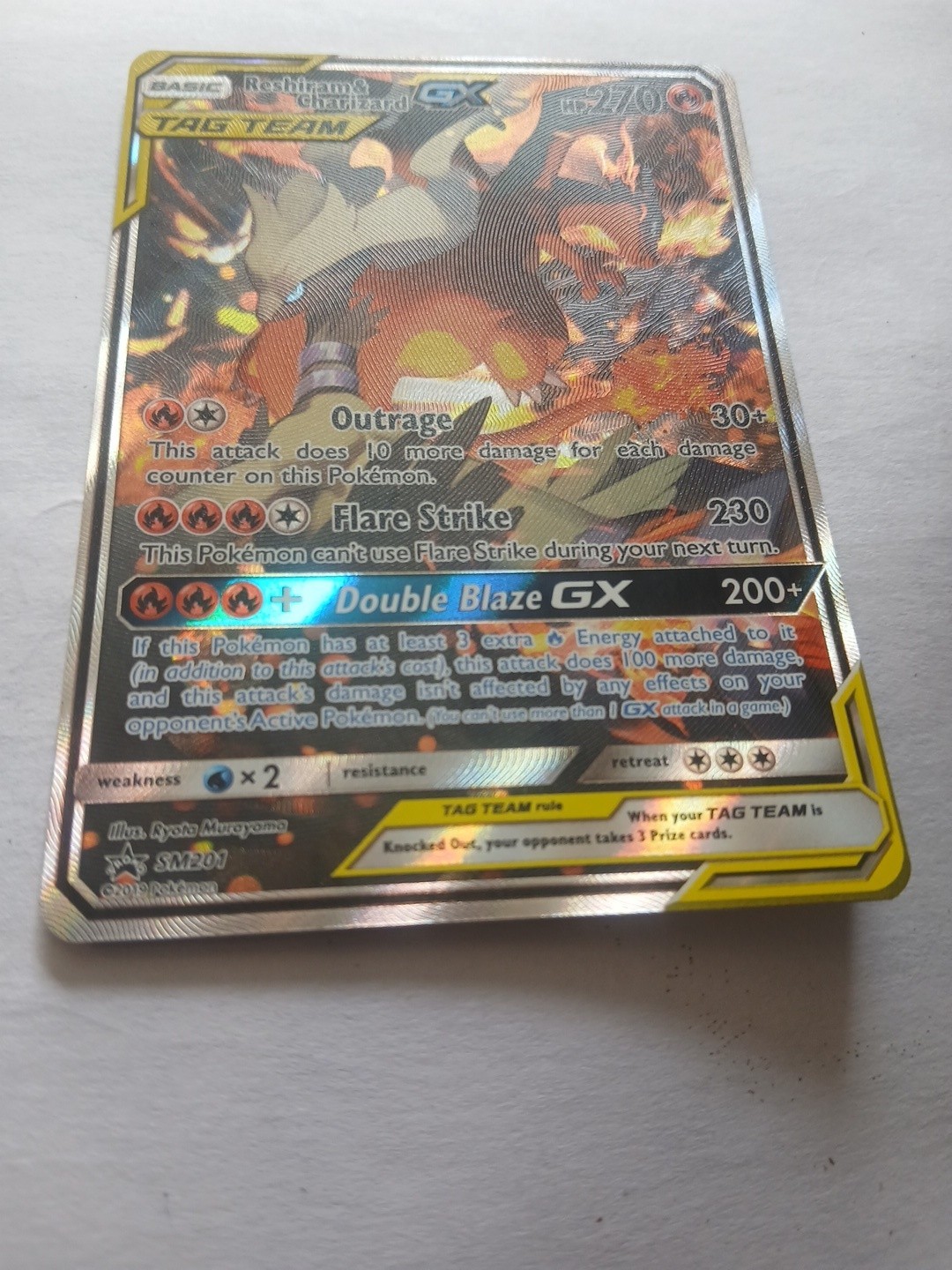 2019 Pokémon Sun Moon Black Promo Tag Team GX Reshiram Charizard #SM201 2019 Pokémon Sun Moon Black Promo Tag Team GX Reshiram Charizard #SM201