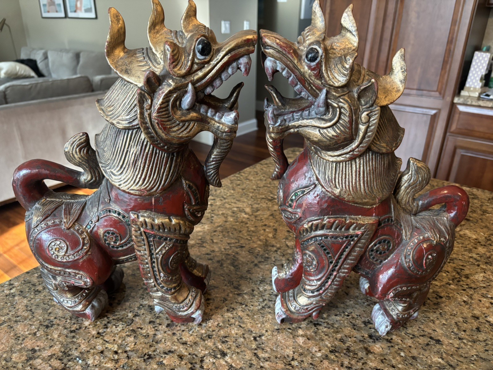 A pair of Vintage hand carved glass-inlaid Wooden Chinthe statues in Red / Gold