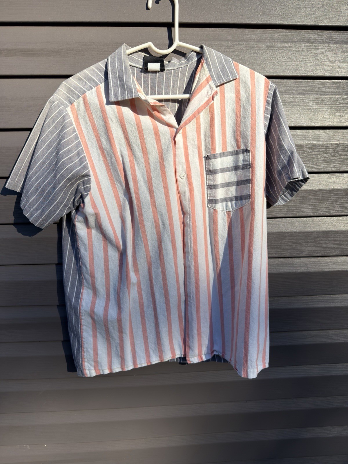 vintage 1950s pink, white, and gray vertically striped short-sleeve vintage 1950s pink, white, and gray vertically striped short-sleeve