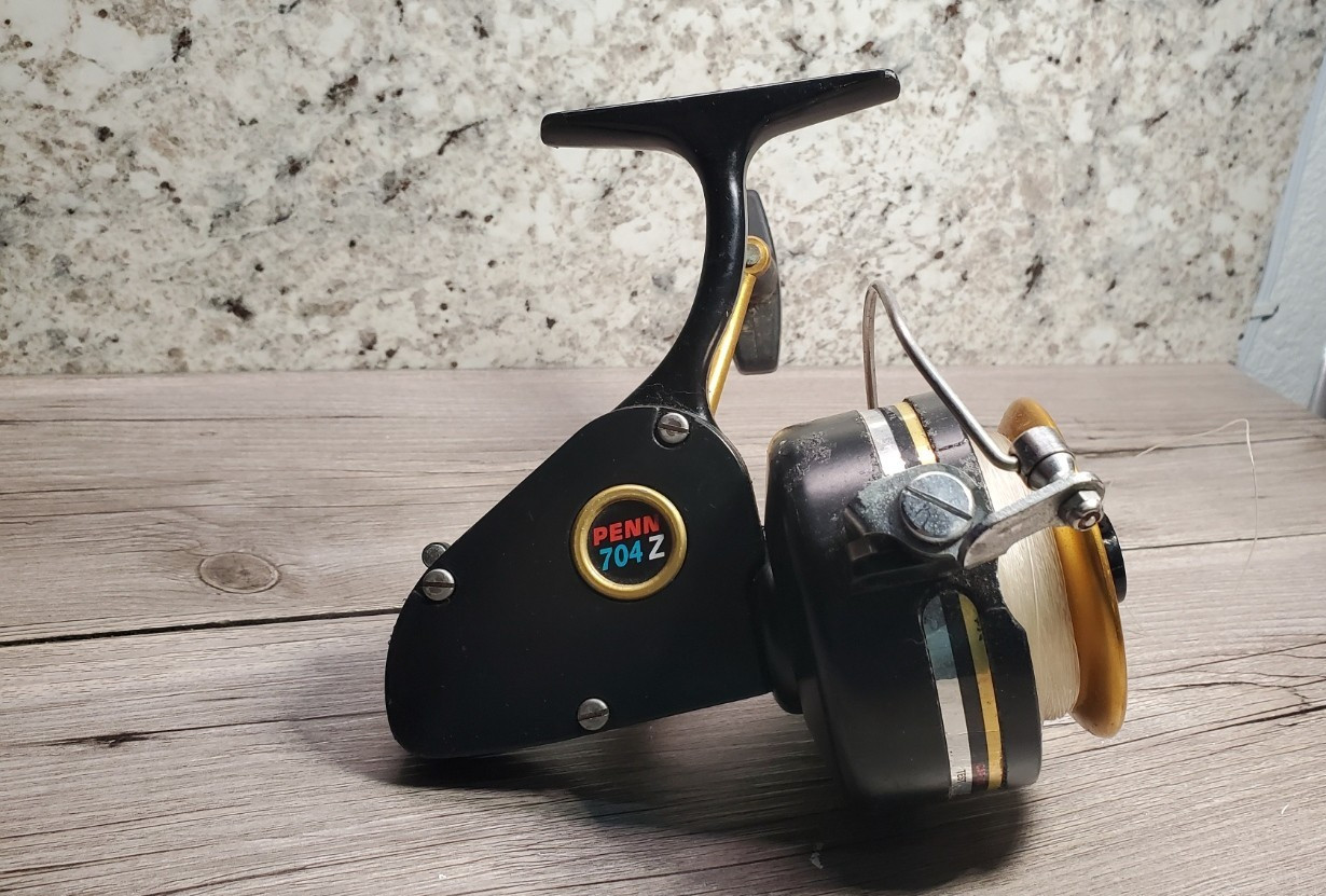 Vintage Penn 704Z Spinfisher Spinning Reel Made in USA Black Gold Front Drag