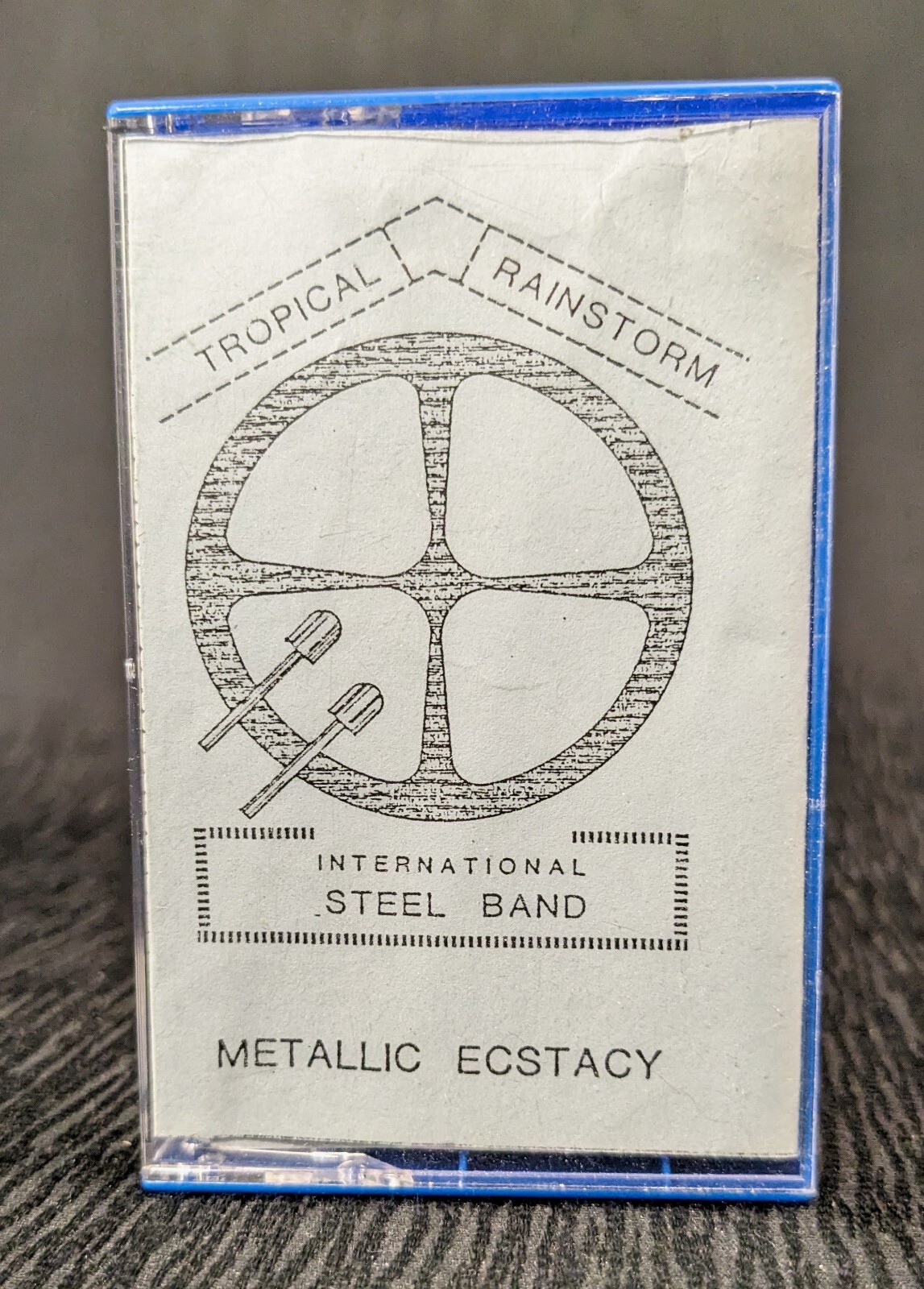 Tropical Rainstorm International Steel Band Cassette - Metallic Ecstasy (1990)