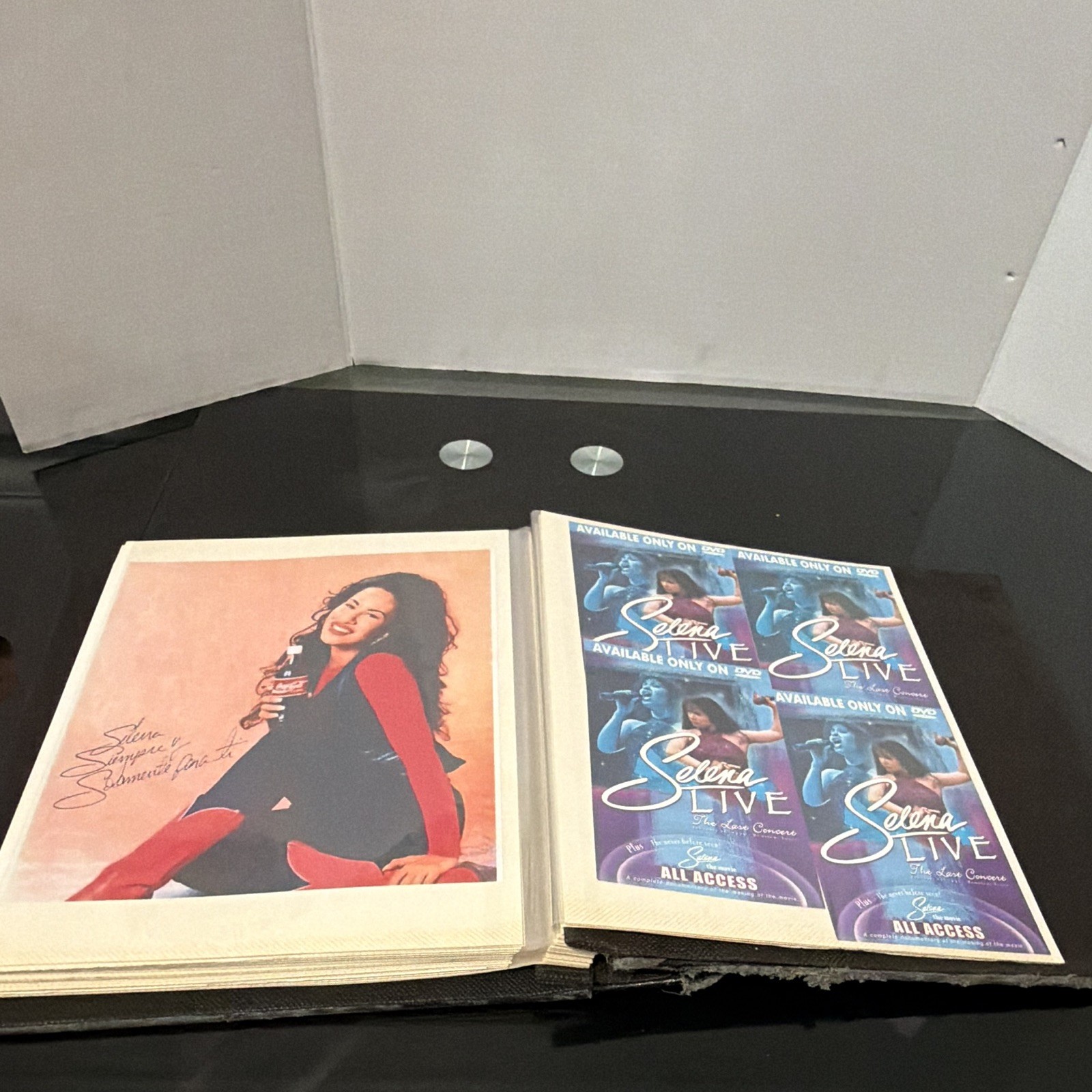 Photo album, newspaper and postcards by SELENA QUINTANILLA