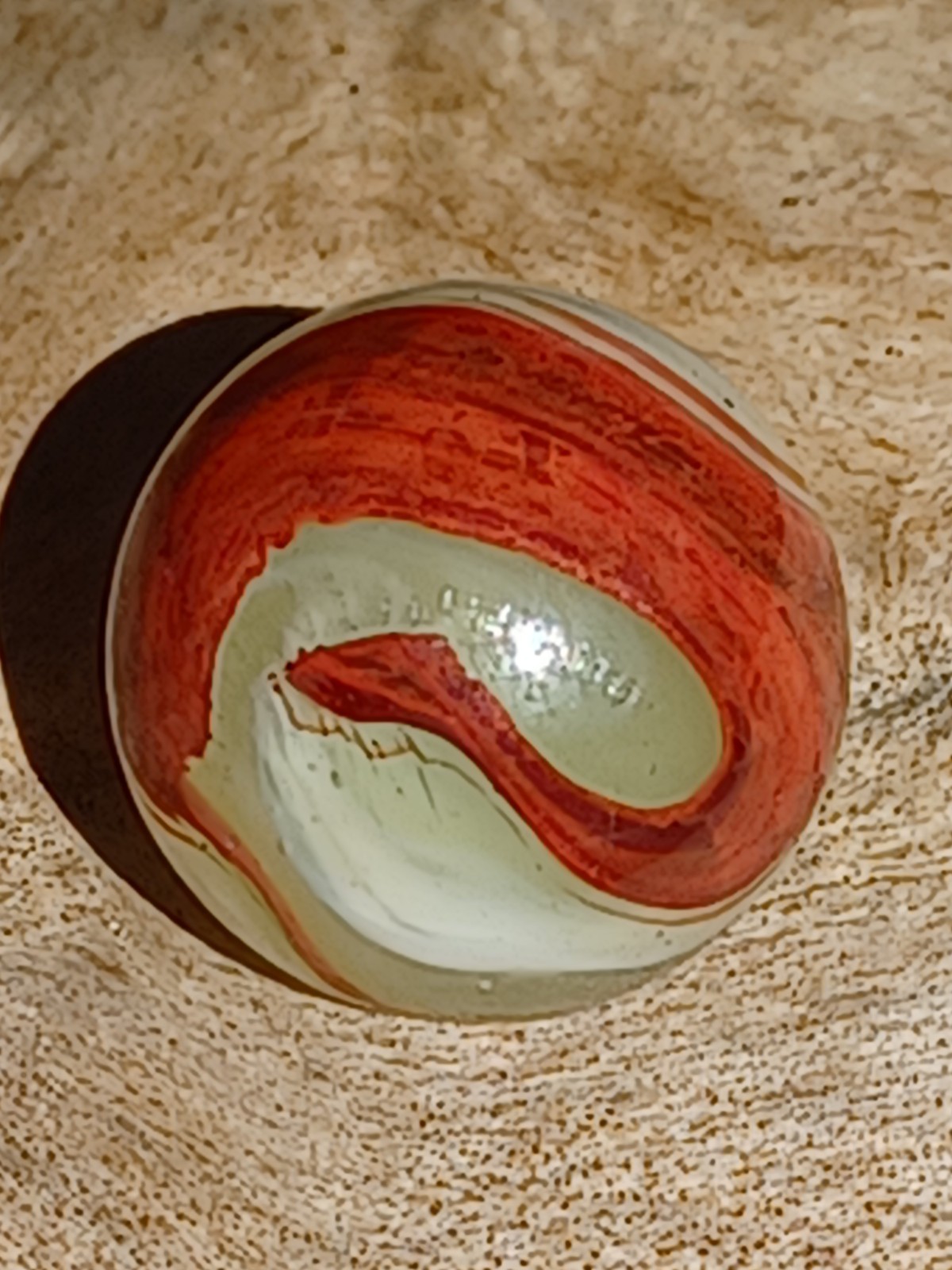 .63 Wet Mint Akro Lemonade Oxblood Marble with an image of a Puff Adder snake 🐍