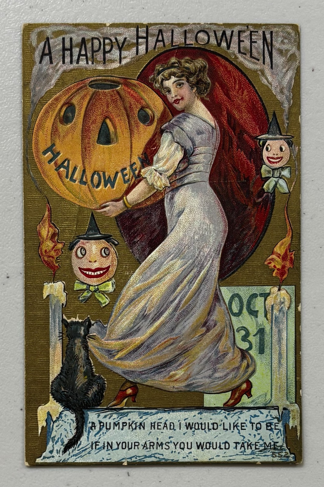 A Happy Halloween JOL pumpkin lady black cat candles goblins postcard 1910s?
