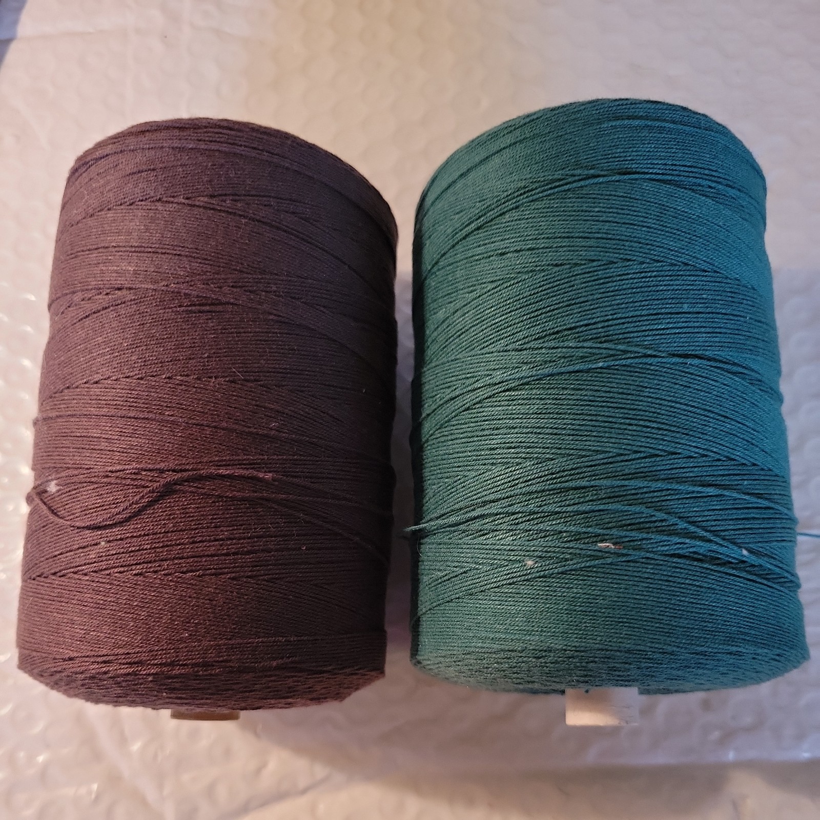 2 new 1.1 pound tubes 8/4 cotton seine twine 1 brown 1 dk green about 740 yds ea 2 new 1.1 pound tubes 8/4 cotton seine twine 1 brown 1 dk green about 740 yds ea