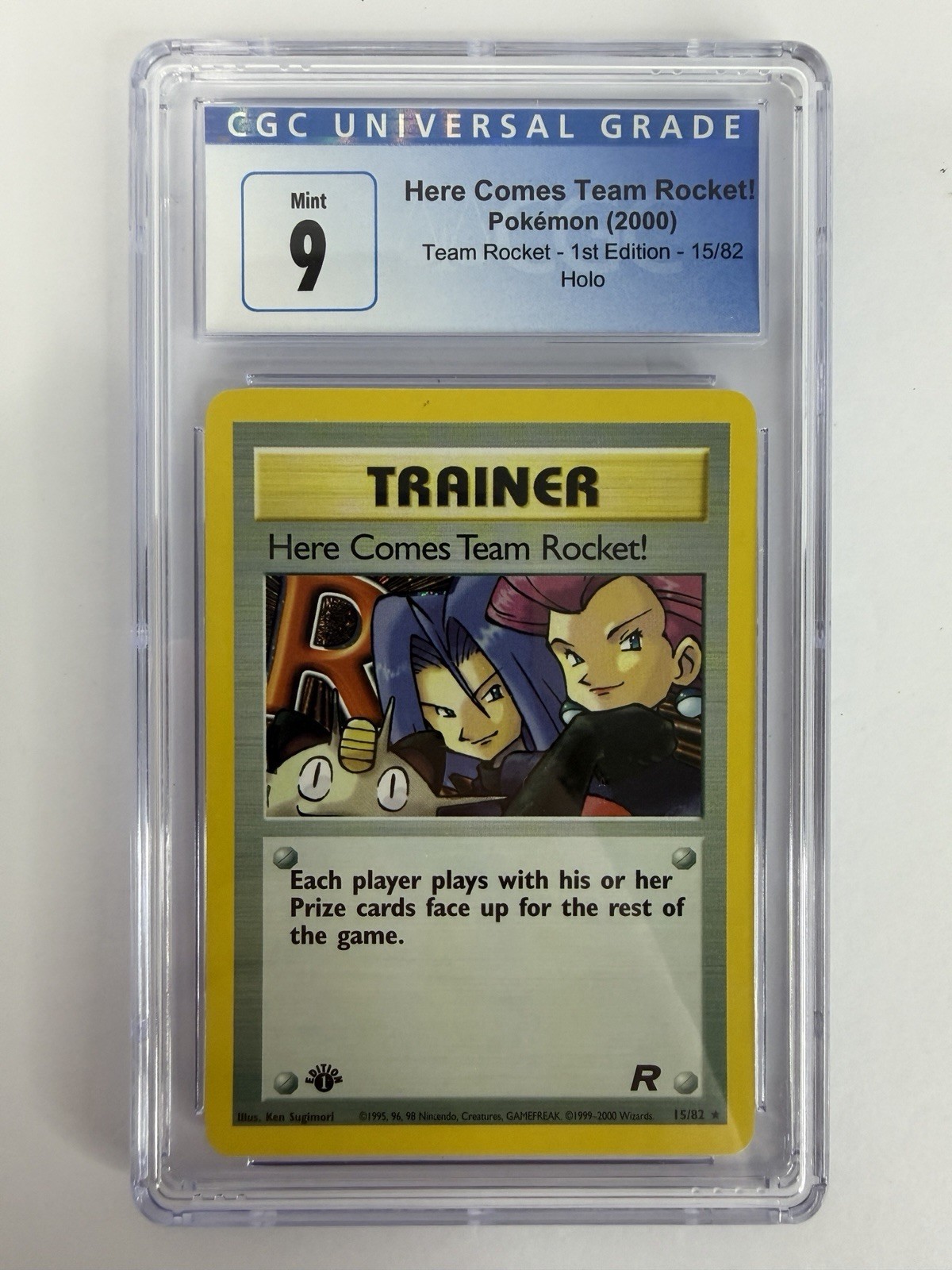 Pokemon Here Comes Team Rocket 15/82 Team Rocket 1st Edition Holo CGC 9