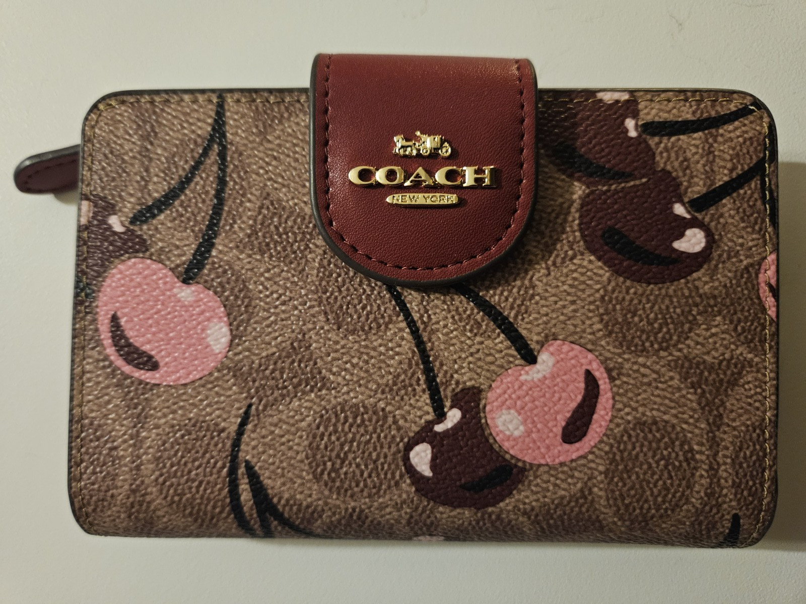 NWOT COACH SMALL WALLET WITH CHERRY DESIGN