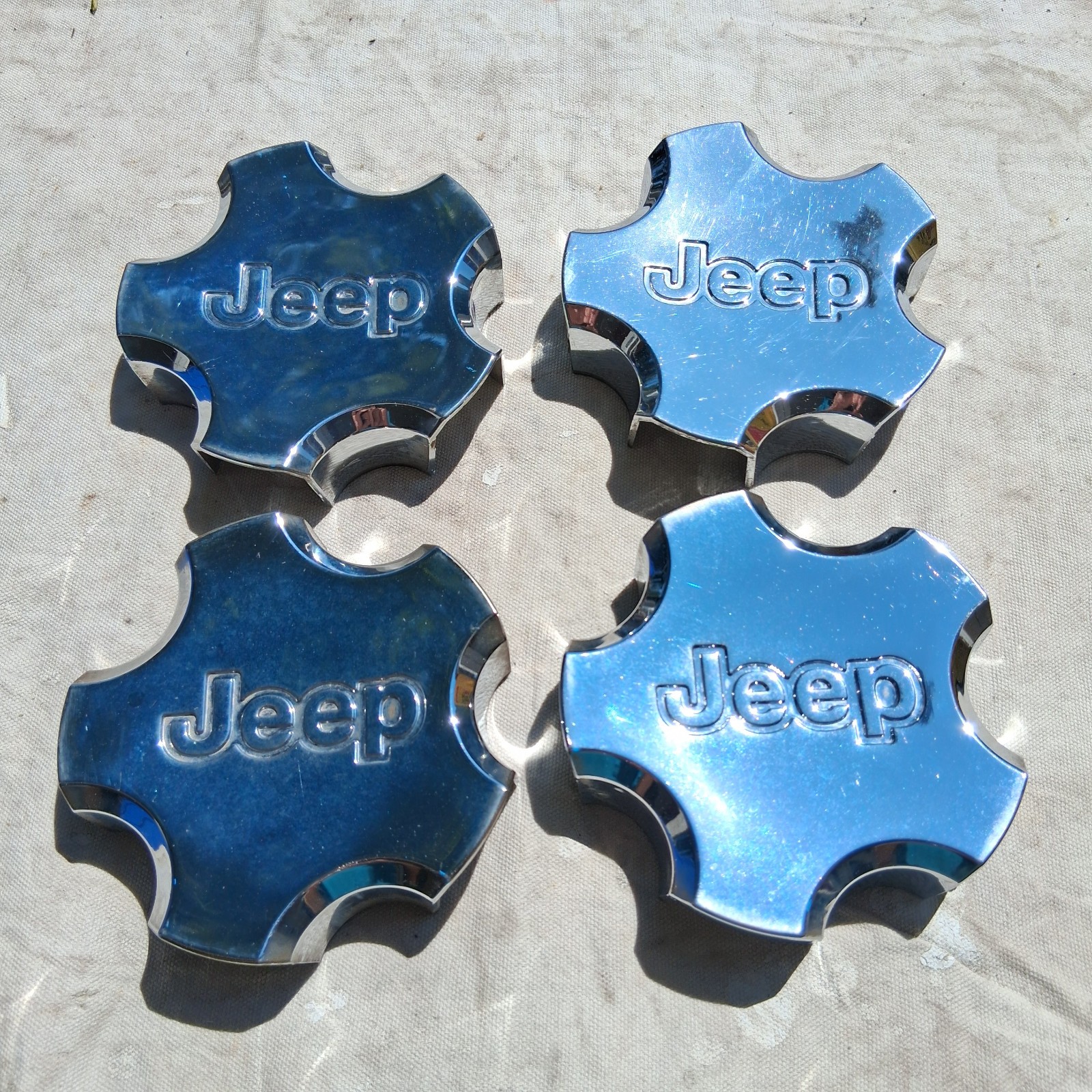 Jeep Grand Cherokee center cap set of 4, chrome, 2002-2004 part # 52080334AA