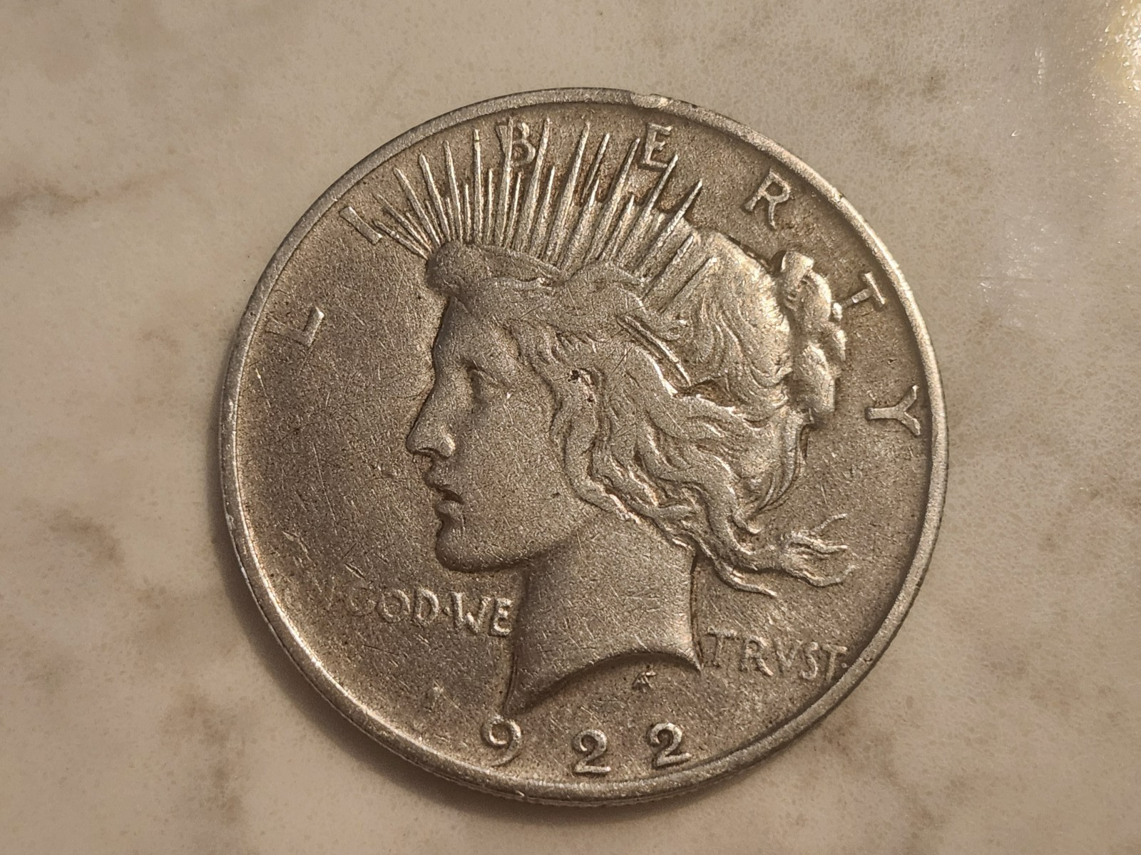 1922 Liberty Peace silver dollar small nic on rim.