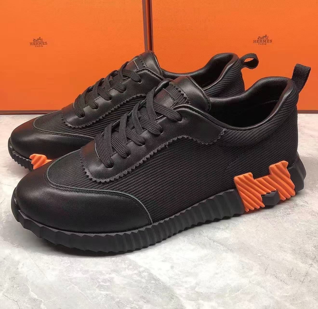 Hermès Unisex Black Mesh Leather Sneakers Orange Serrated Sole Lace‑Up Luxury Hermès Unisex Black Mesh Leather Sneakers Orange Serrated Sole Lace‑Up Luxury
