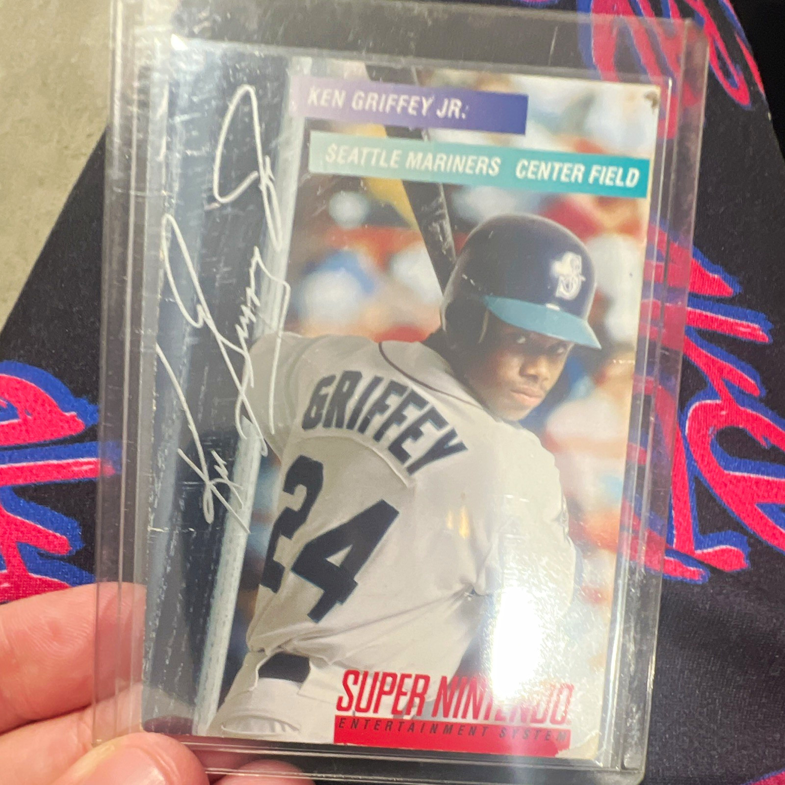 Ken Griffey Jr. 1994 Super Nintendo Seattle Mariners Baseball Card Damaged Ken Griffey Jr. 1994 Super Nintendo Seattle Mariners Baseball Card Damaged