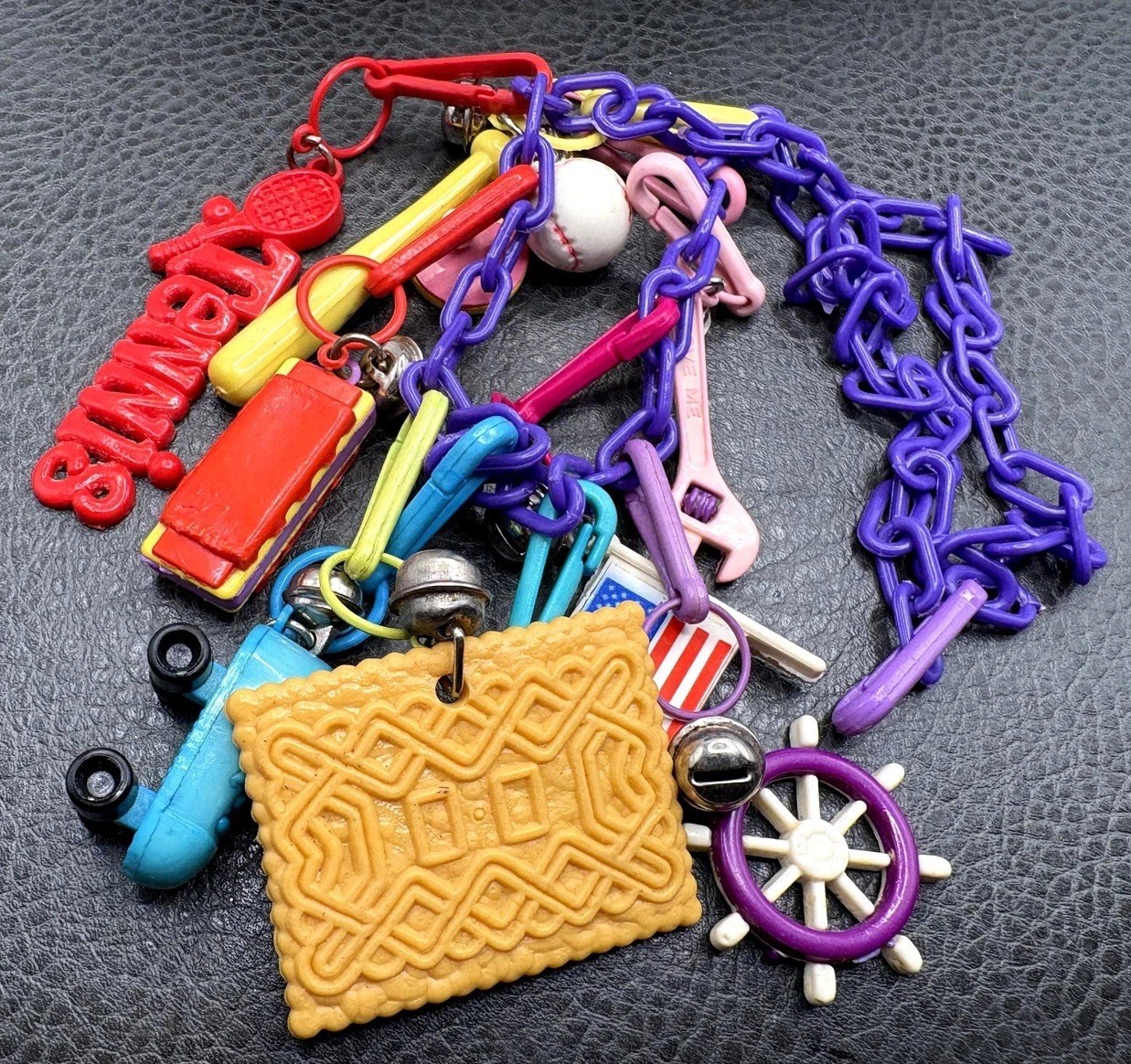 VTG 1980s Plastic Bell Charm 22” Necklace Purple Chain Tennis Cookie Flag Bells VTG 1980s Plastic Bell Charm 22” Necklace Purple Chain Tennis Cookie Flag Bells