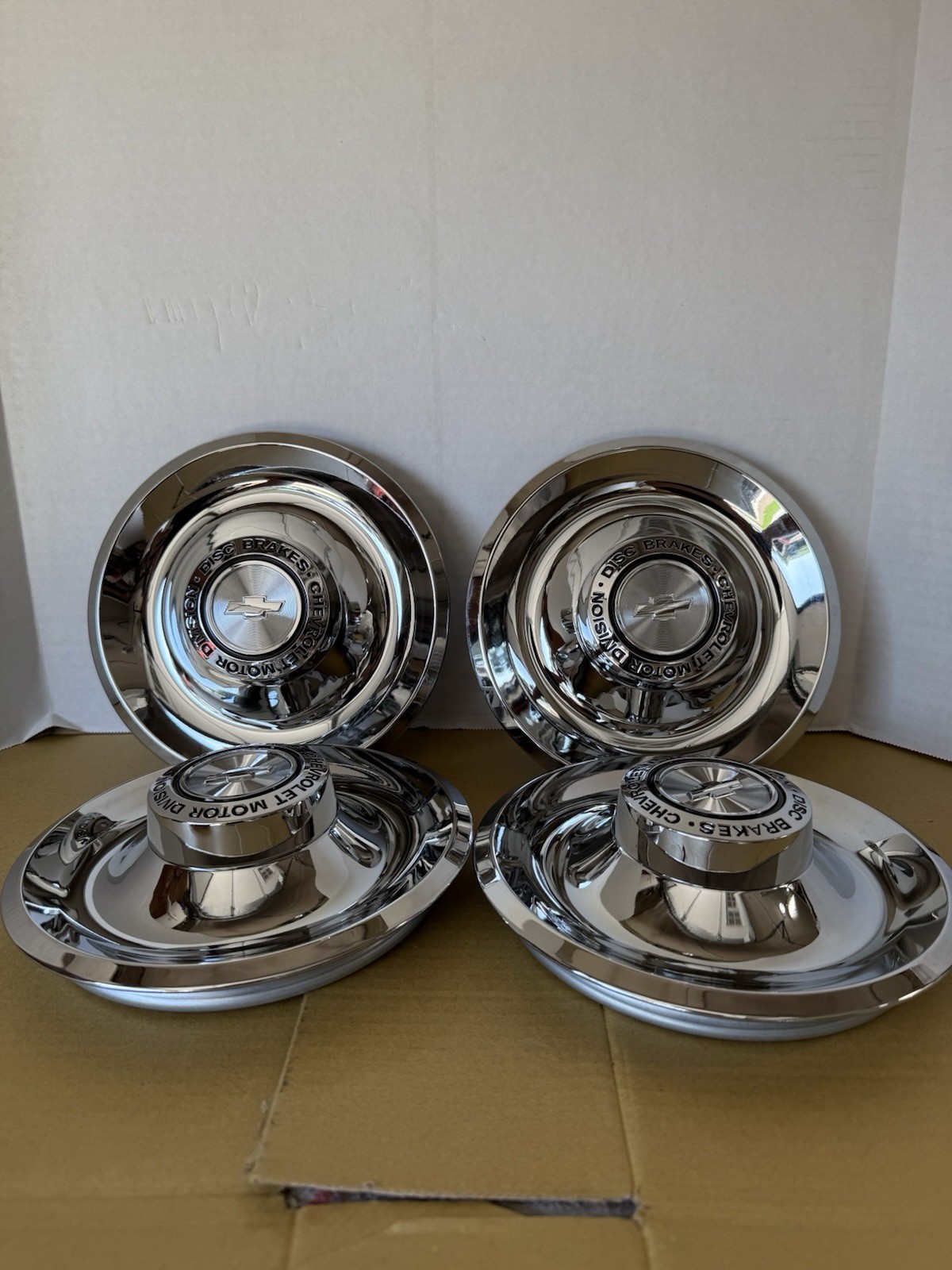 (4) ORIGINAL STYLE GM LICENSED DISC BRAKES CENTER CAPS FOR THE RALLY WHEELS (4) ORIGINAL STYLE GM LICENSED DISC BRAKES CENTER CAPS FOR THE RALLY WHEELS