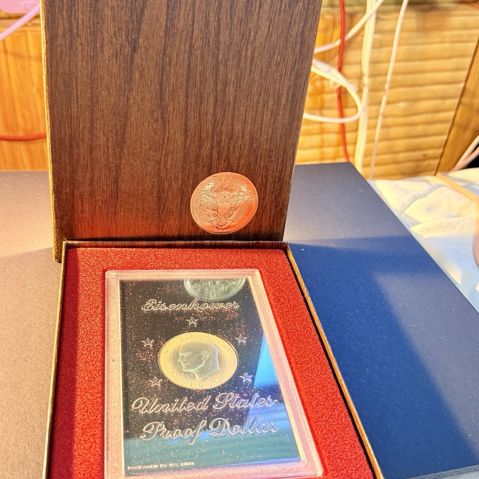 1974-S $1 Silver DCAM (Proof) Ike Dollar. In Attractive Wood Panel Box Display