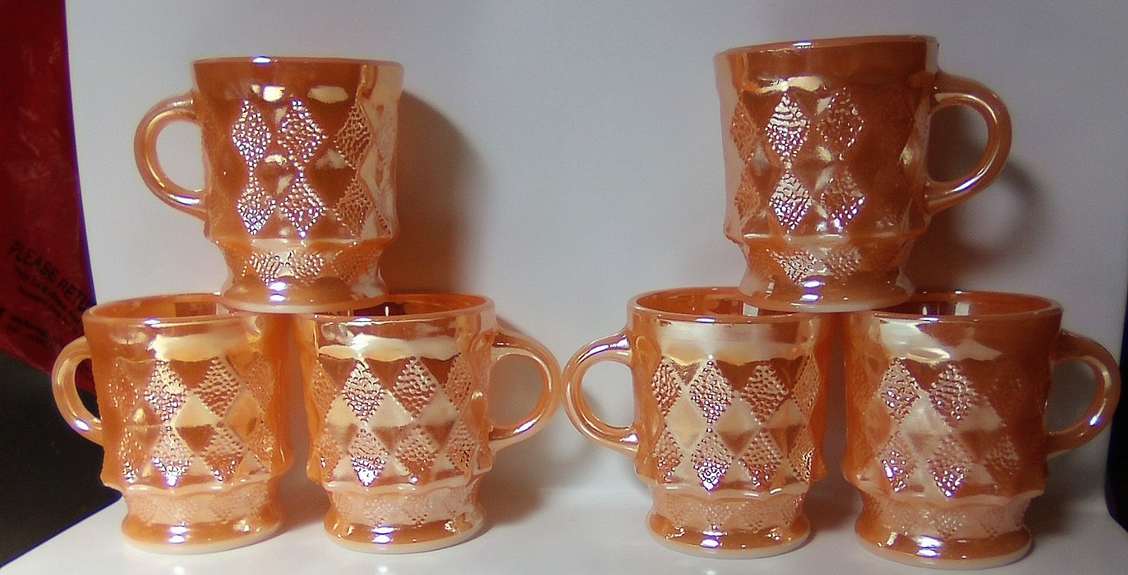 Vintage fire king peach lustre pineapple kimberly mugs.
